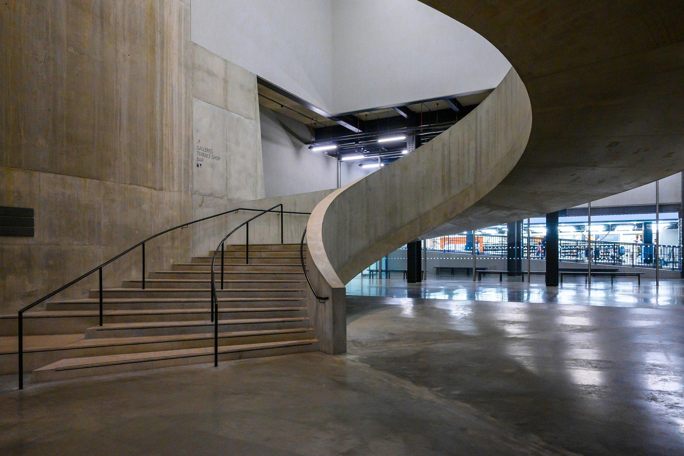 White concrete building with an external metal staircase