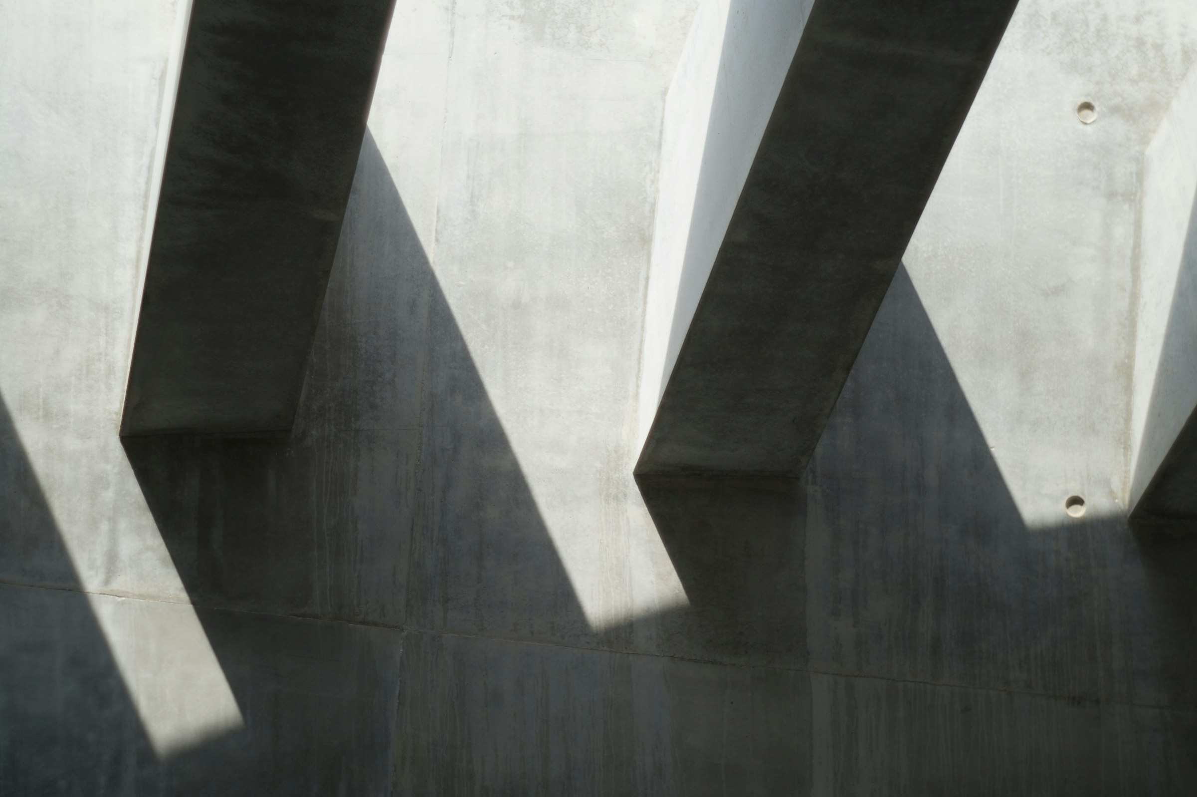 The shadow of a building falling across its own facade