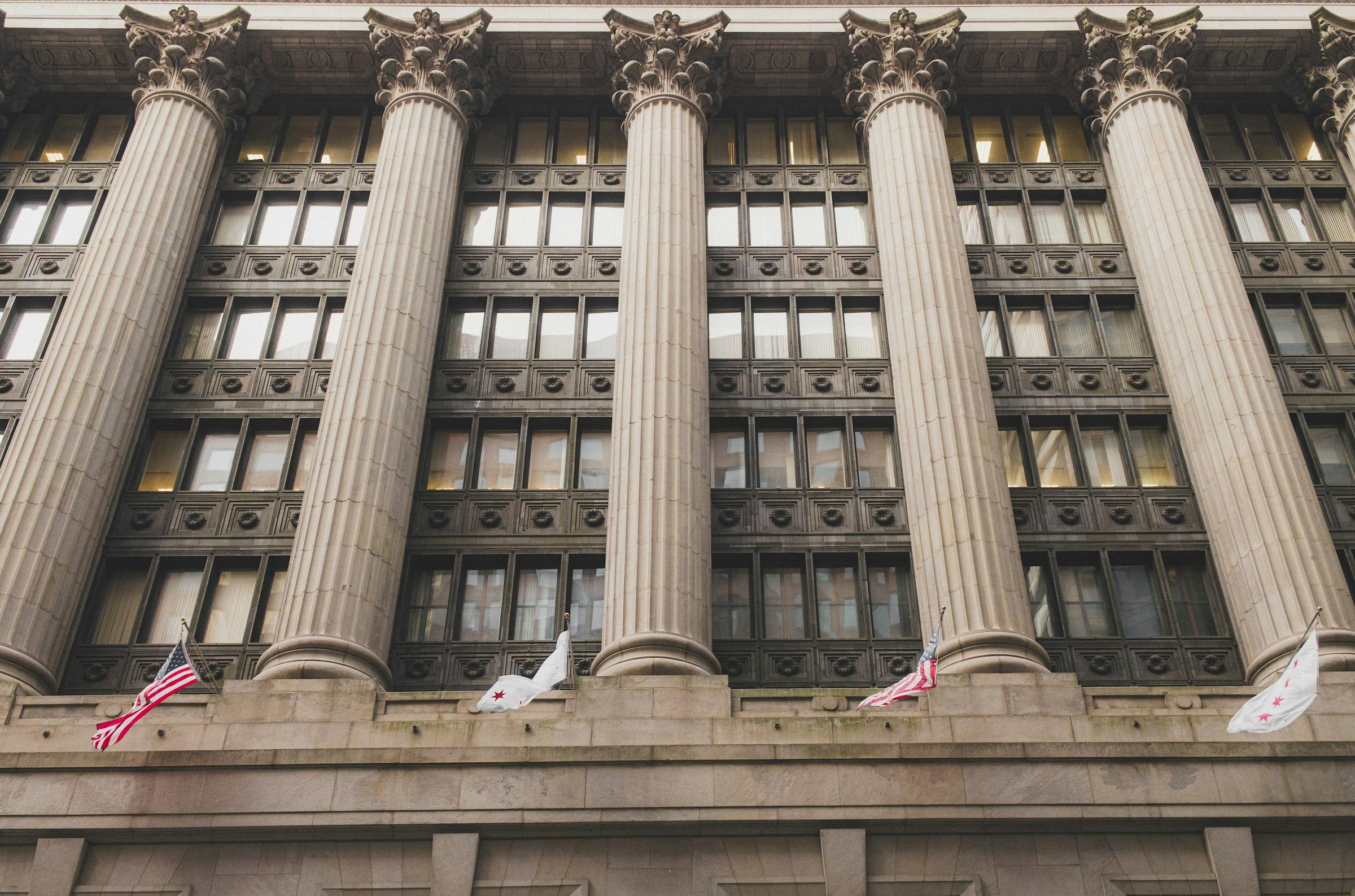 Grand building facade with tall classical columns and many windows