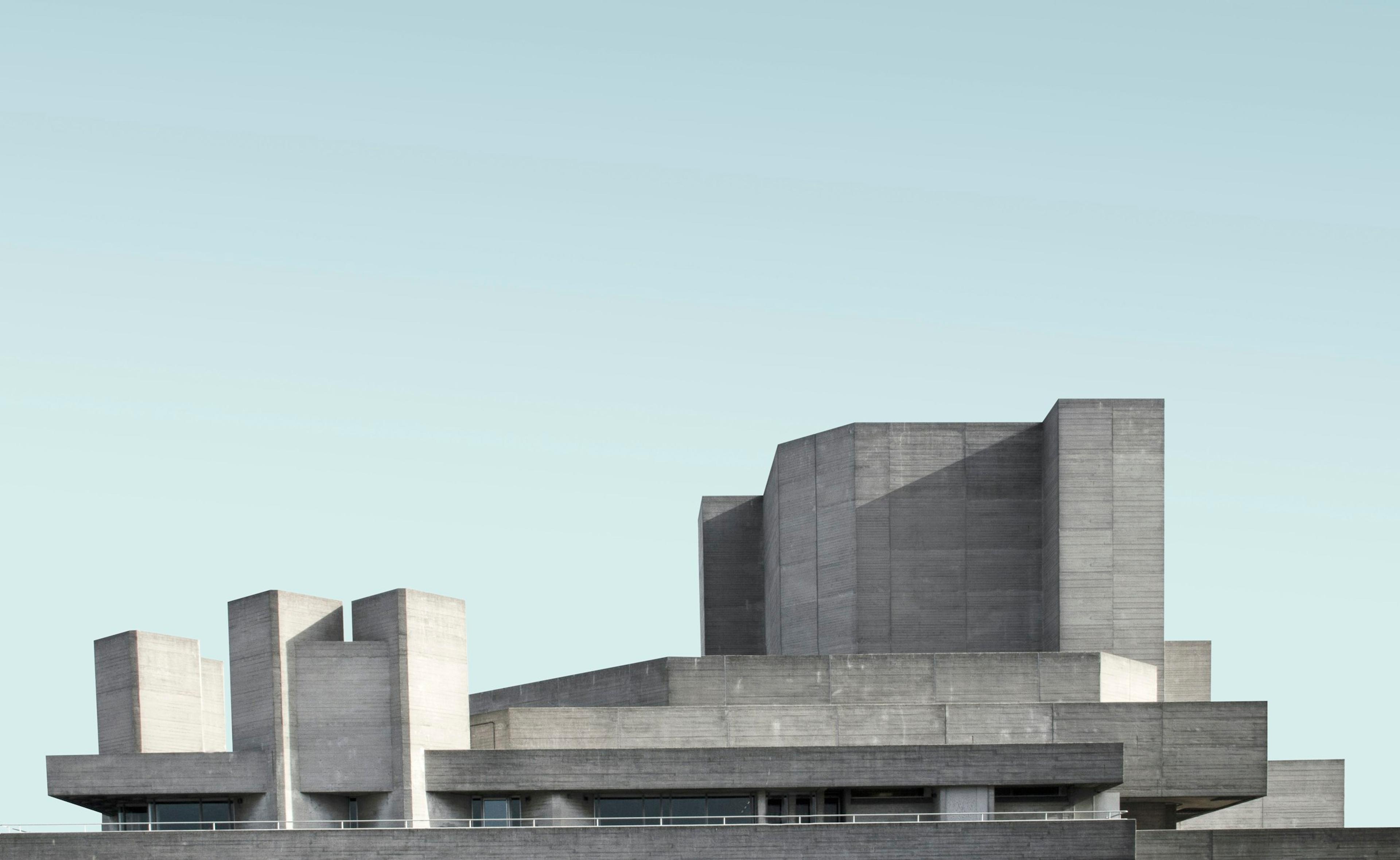 Gray concrete building photographed against an open sky