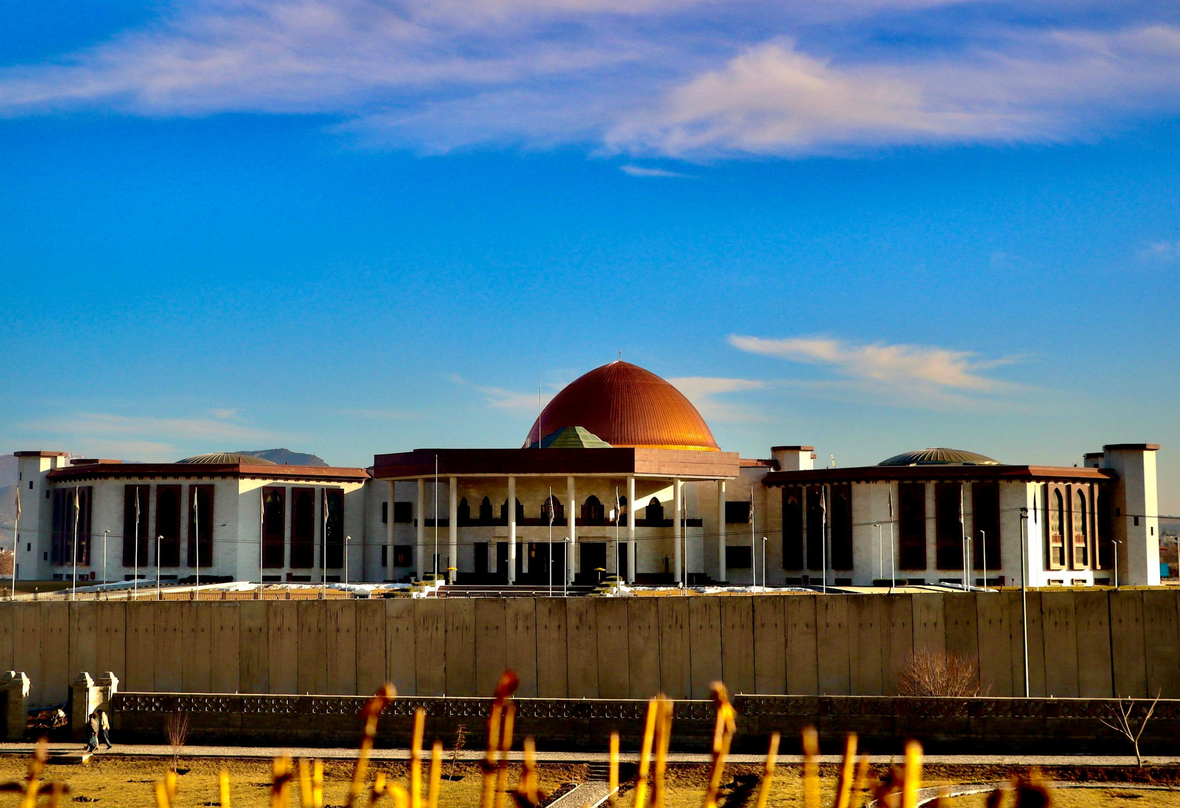 Modern building with a large dome under a blue sky