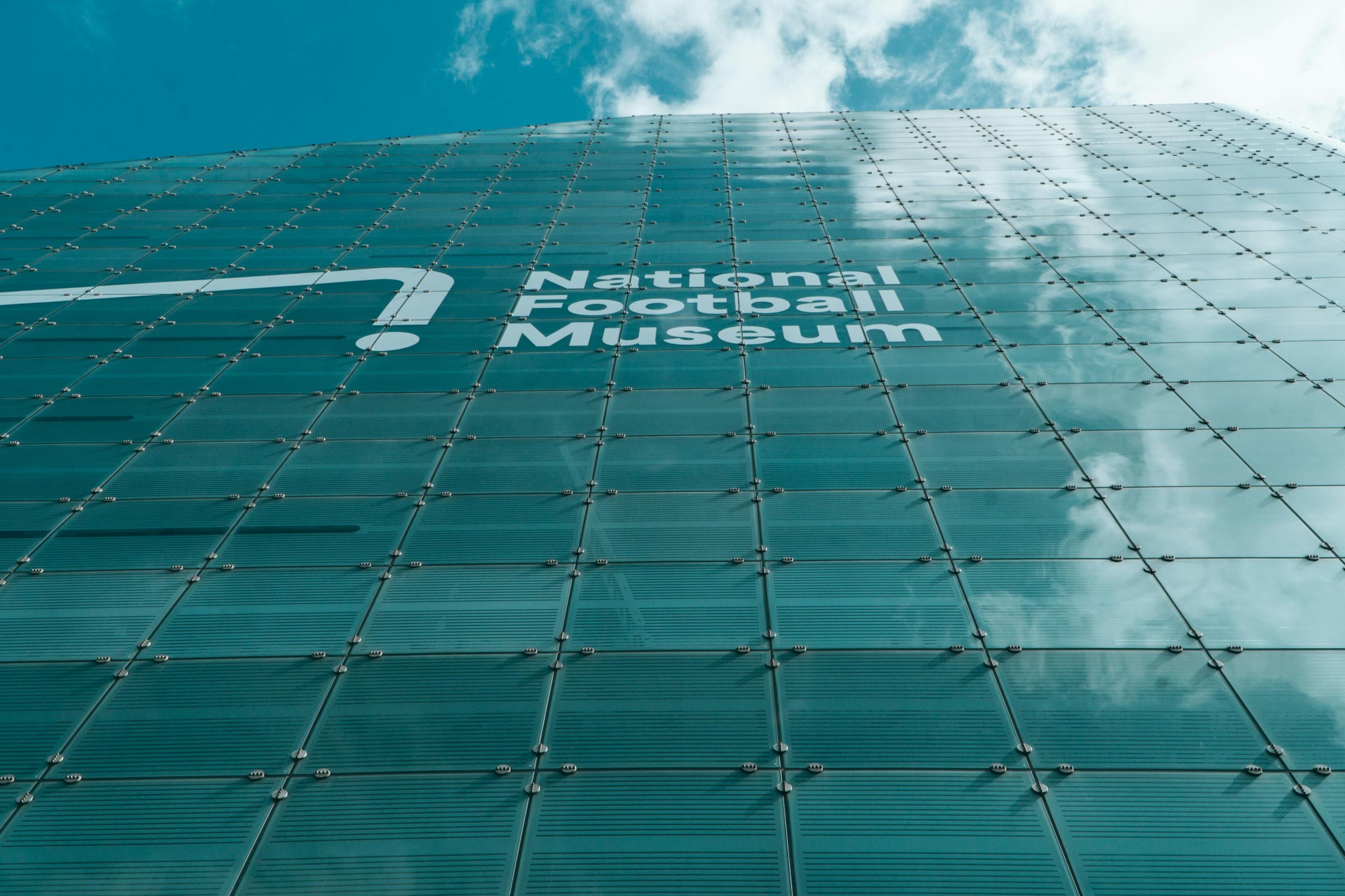 Museum exterior with a full-height glass facade