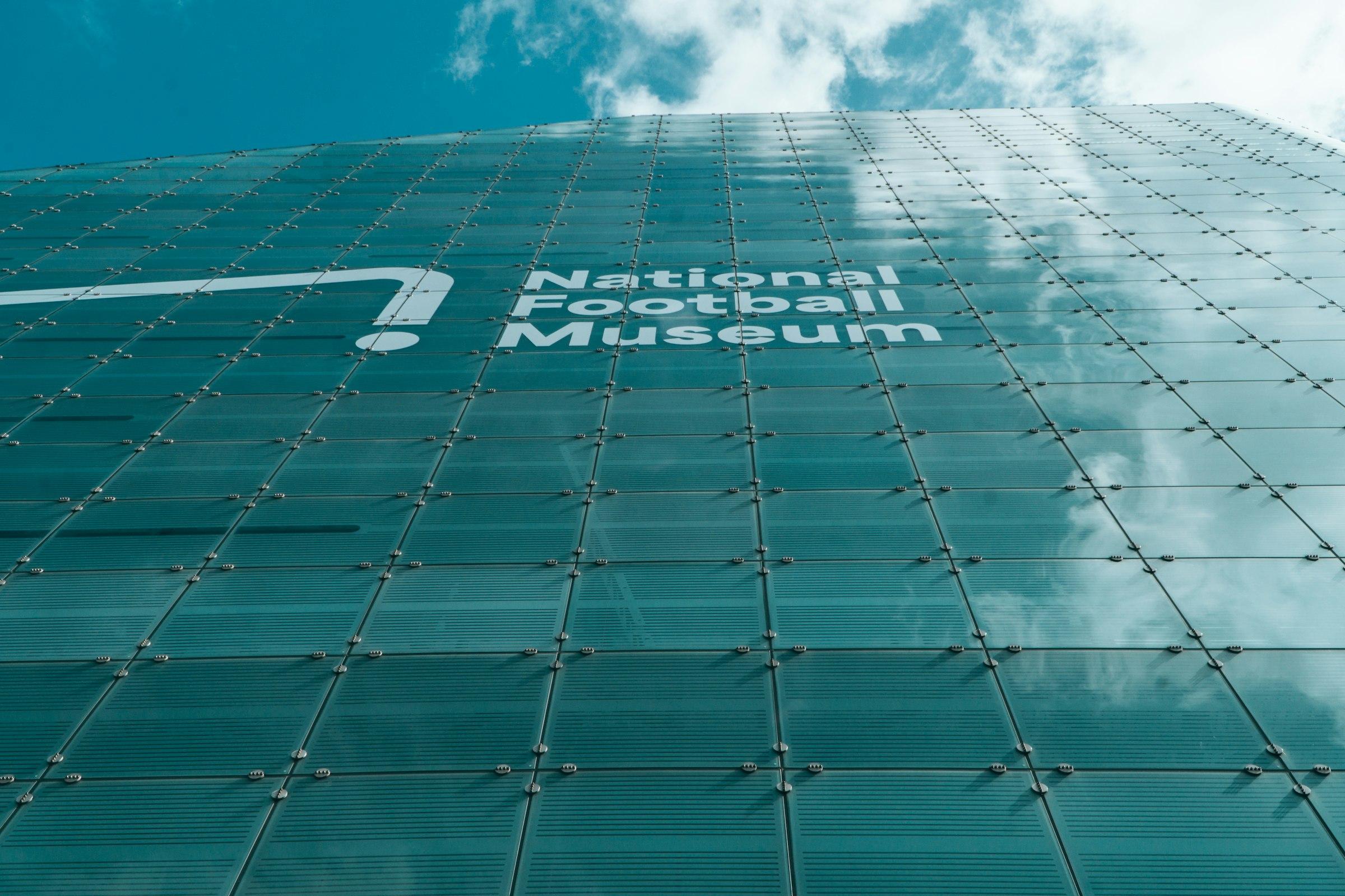 Museum exterior with a full-height glass facade