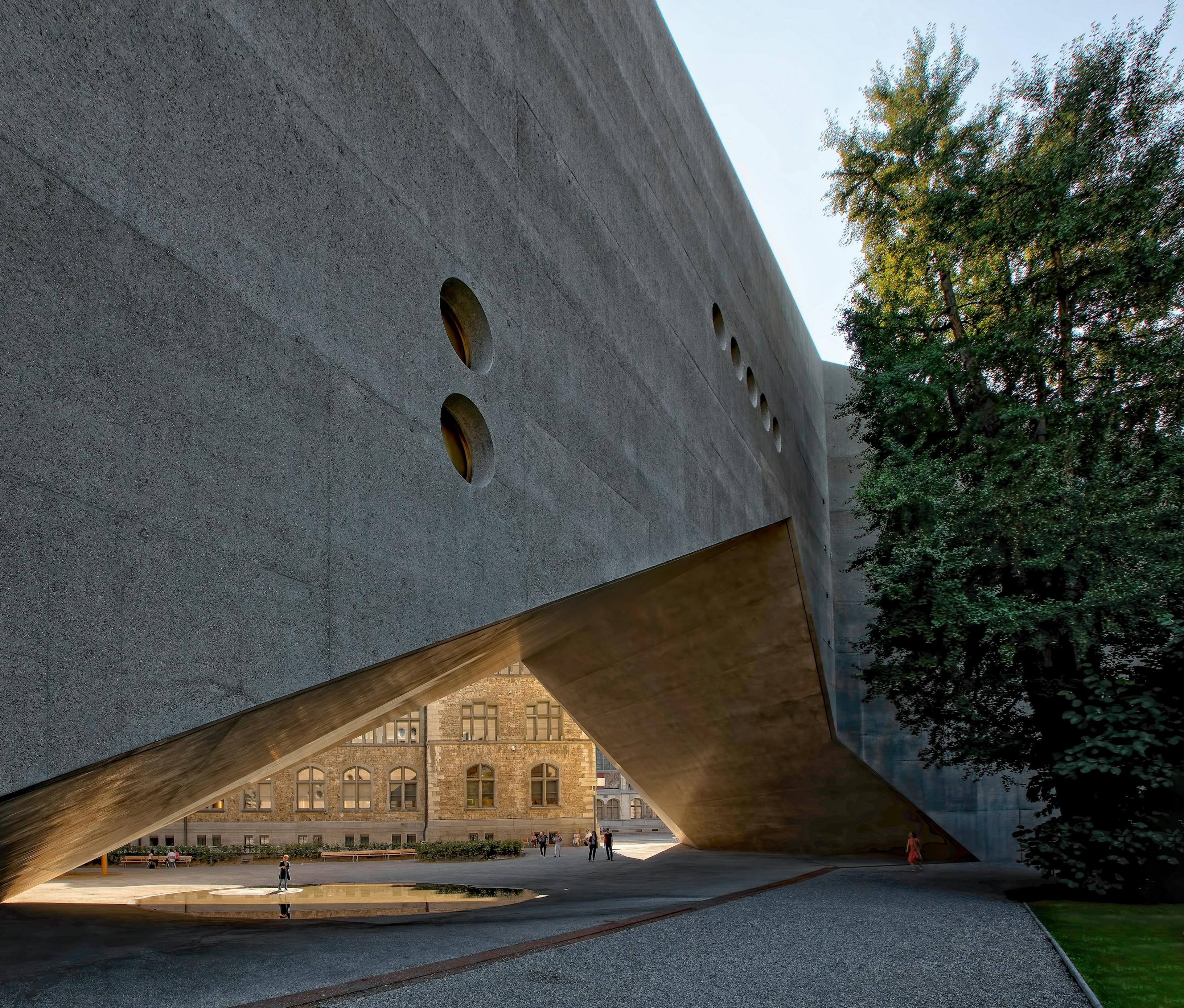 A gray concrete wall with a shape carved into its surface