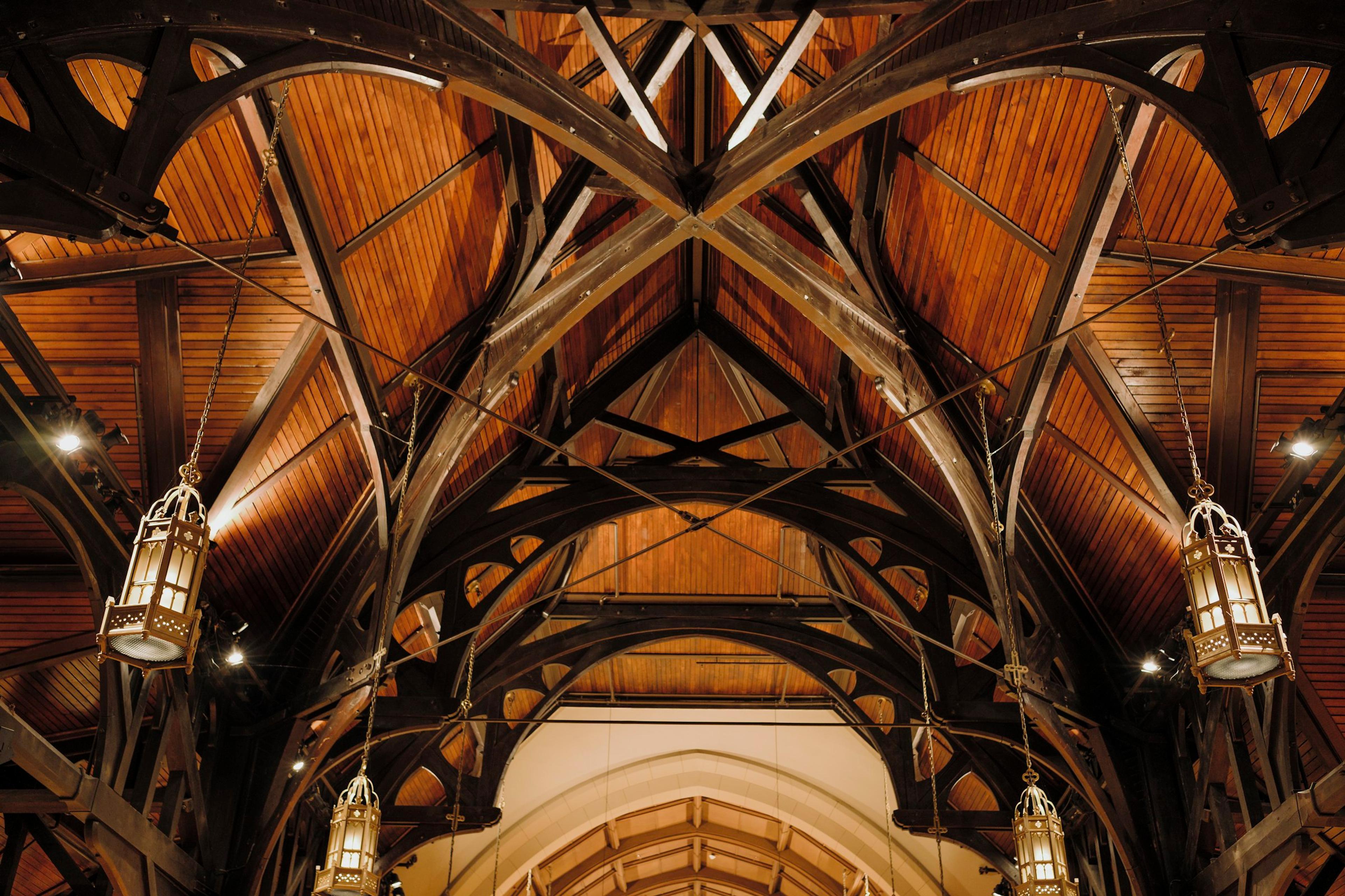Intricate timber ceiling with hanging lanterns