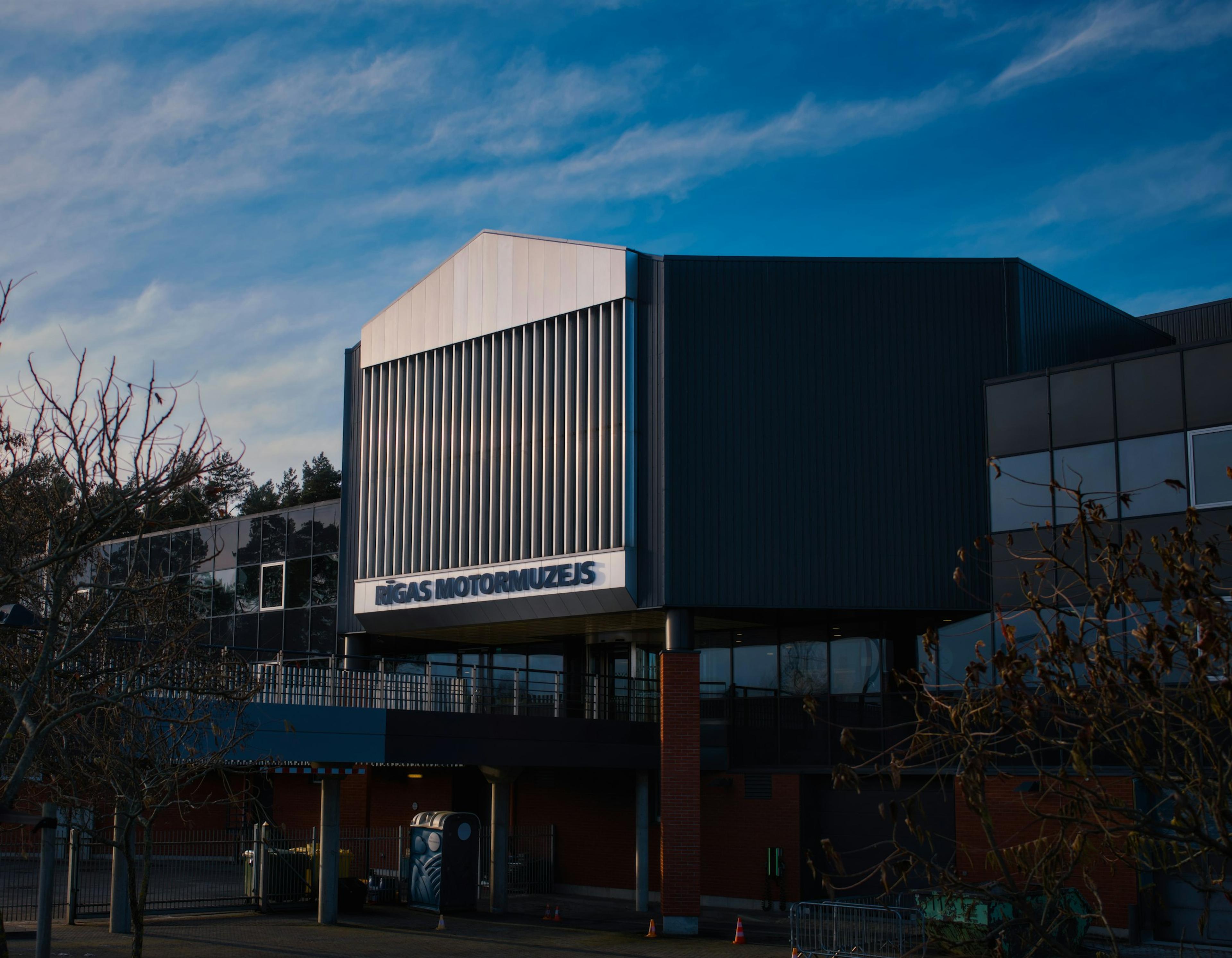 Modern building with a dark facade and white accents
