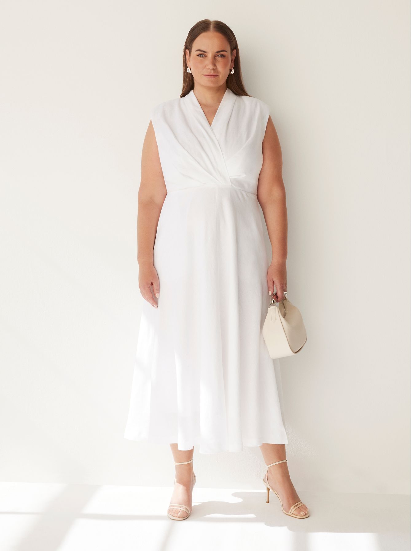 Jelena Dokic wears Commonry Tahli Dress and holding The Isla Mini Hobo