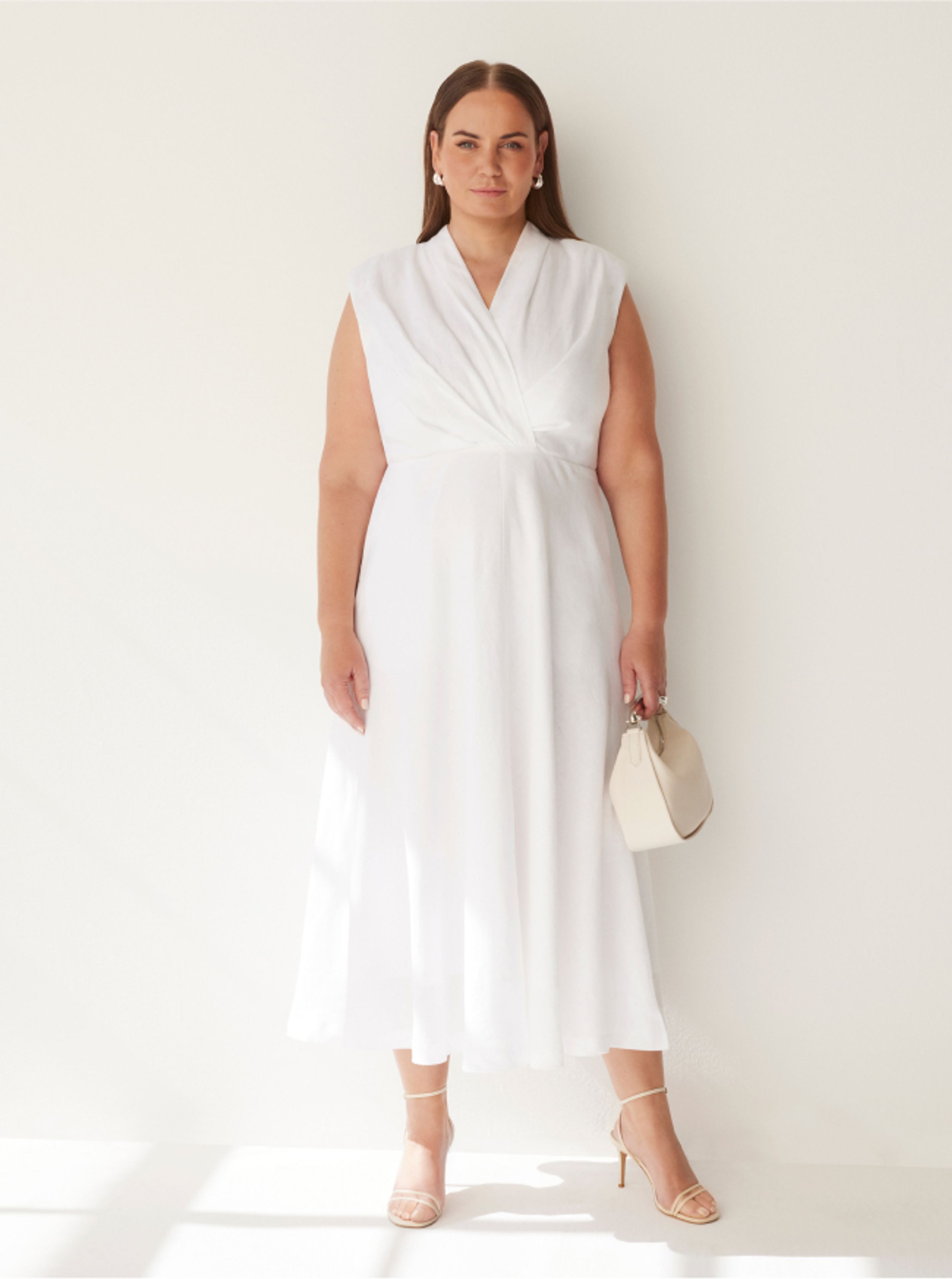 Jelena Dokic wears Commonry Tahli Dress and holding The Isla Mini Hobo