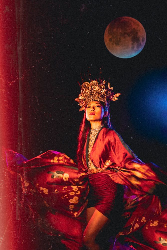 east asian woman with a crown and moon