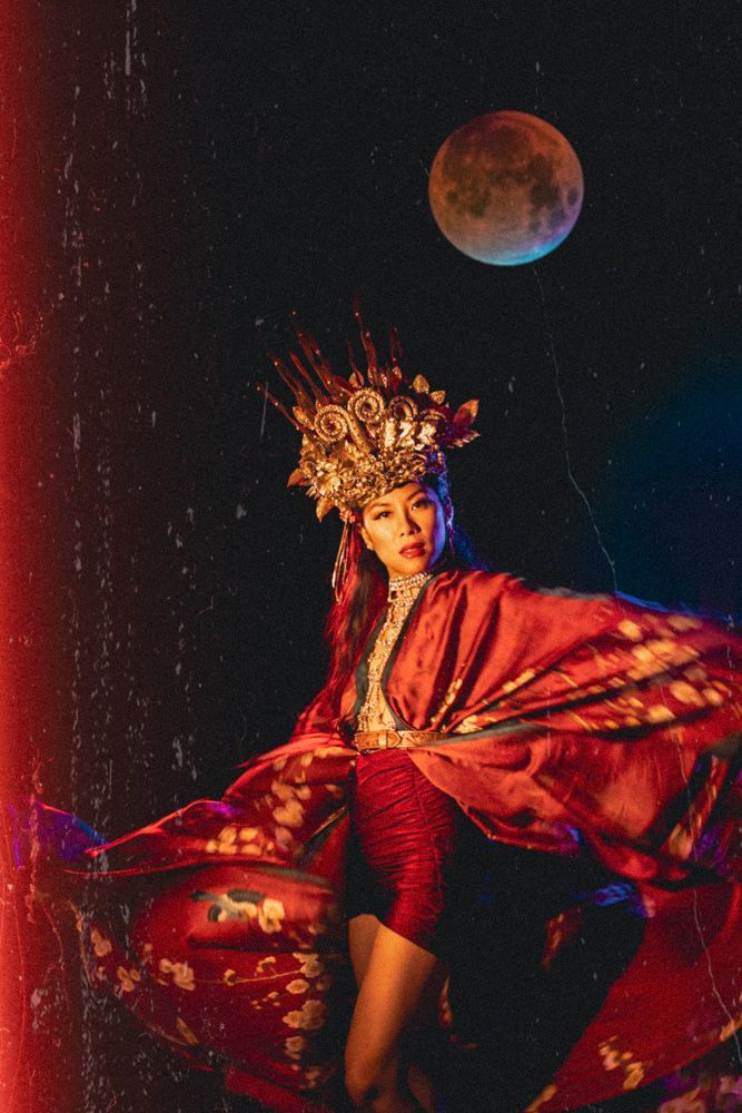 east asian woman with a crown and moon
