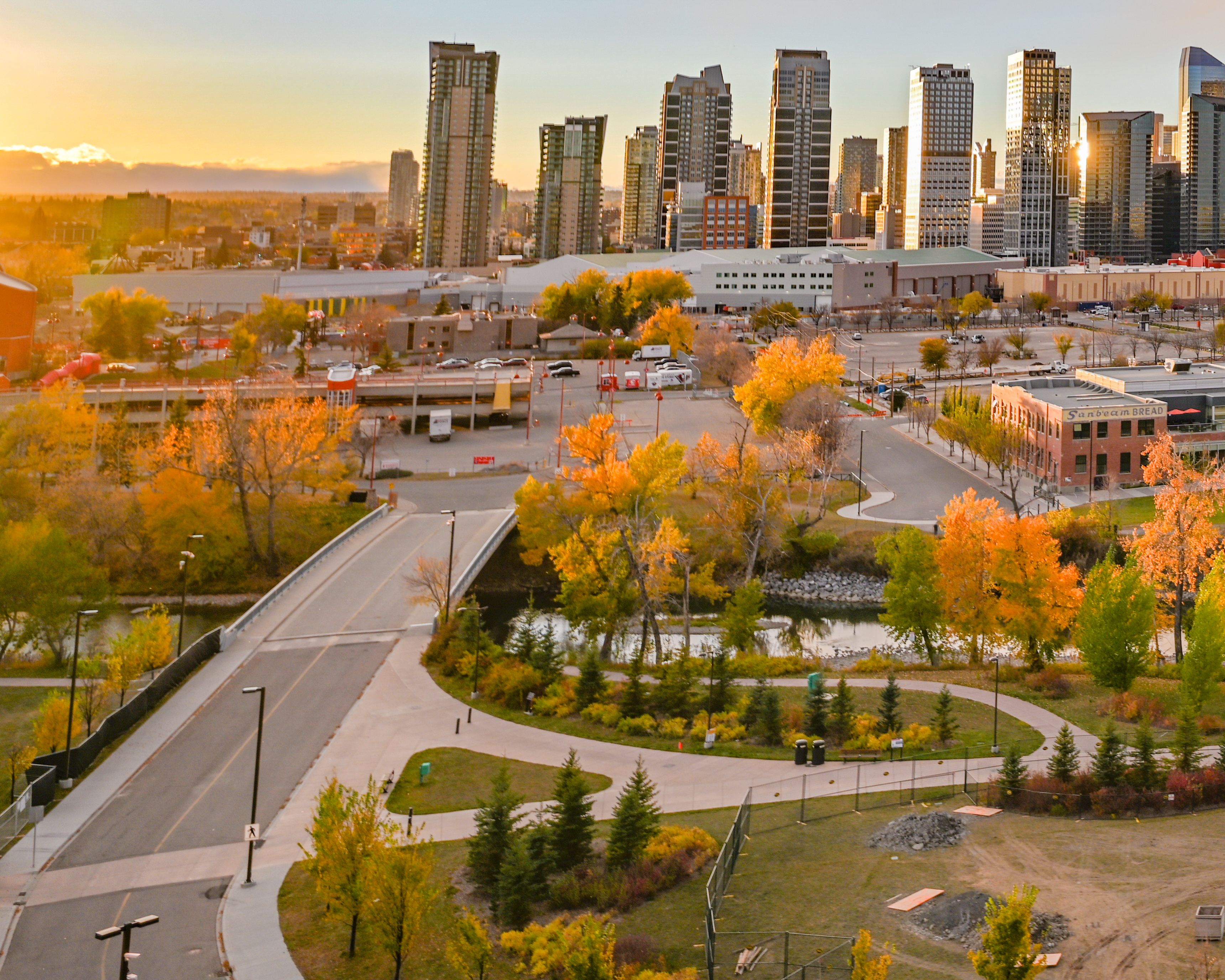 A photograph of the Calgary skyline at sunset during the fall.