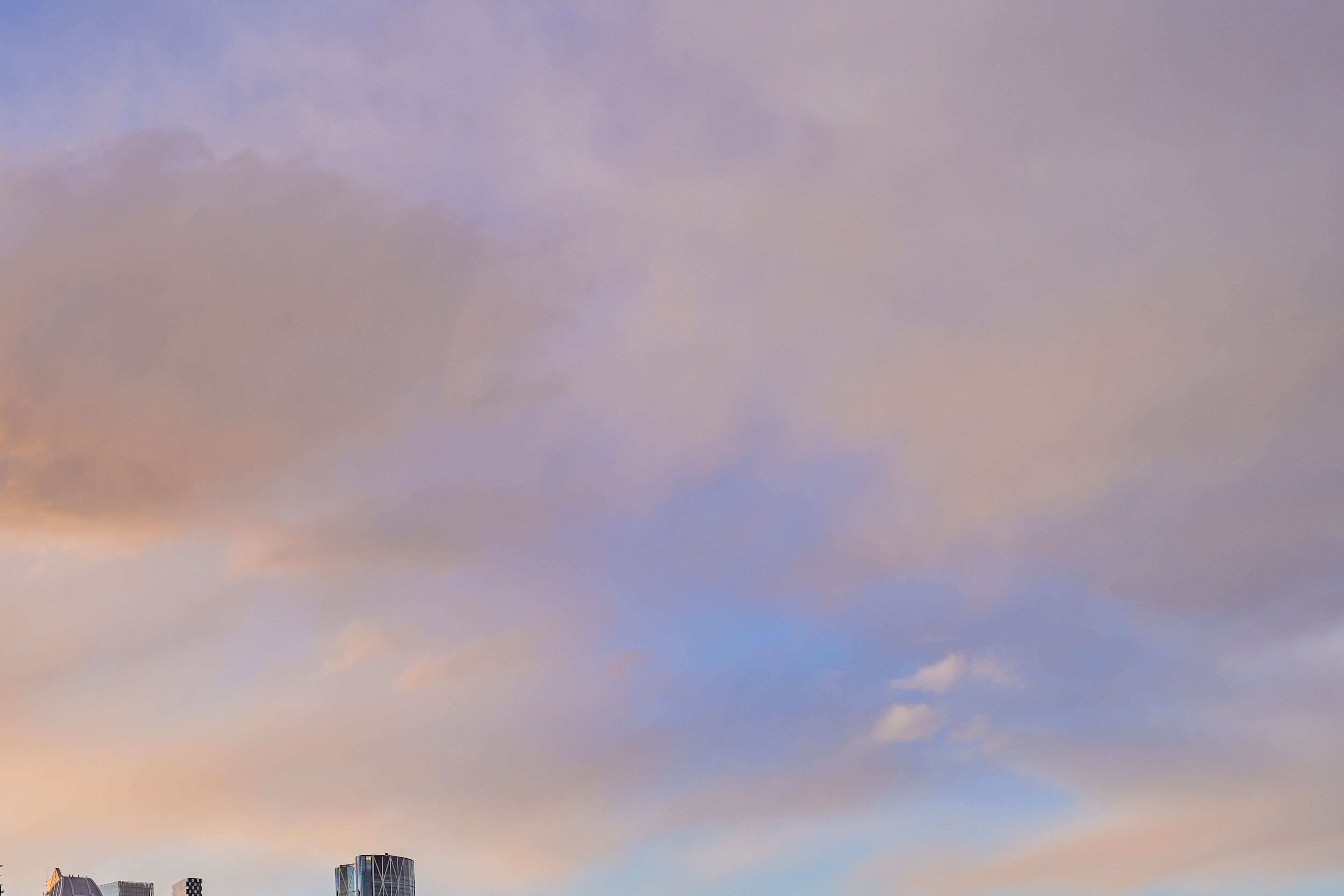 A photograph of the Calgary skyline at sunset during the fall.