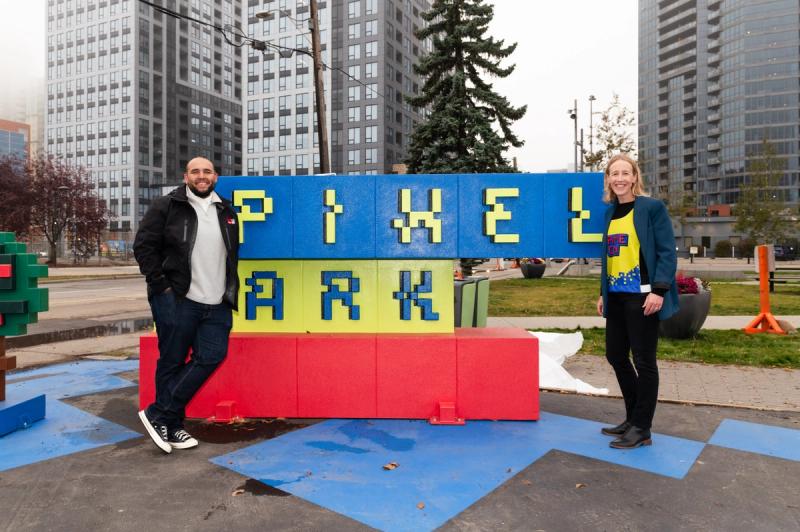 A photograph of CEO Kate Thompson and Ward 8 Councillor Courtney Walcott reveal the Pixel Park Sign