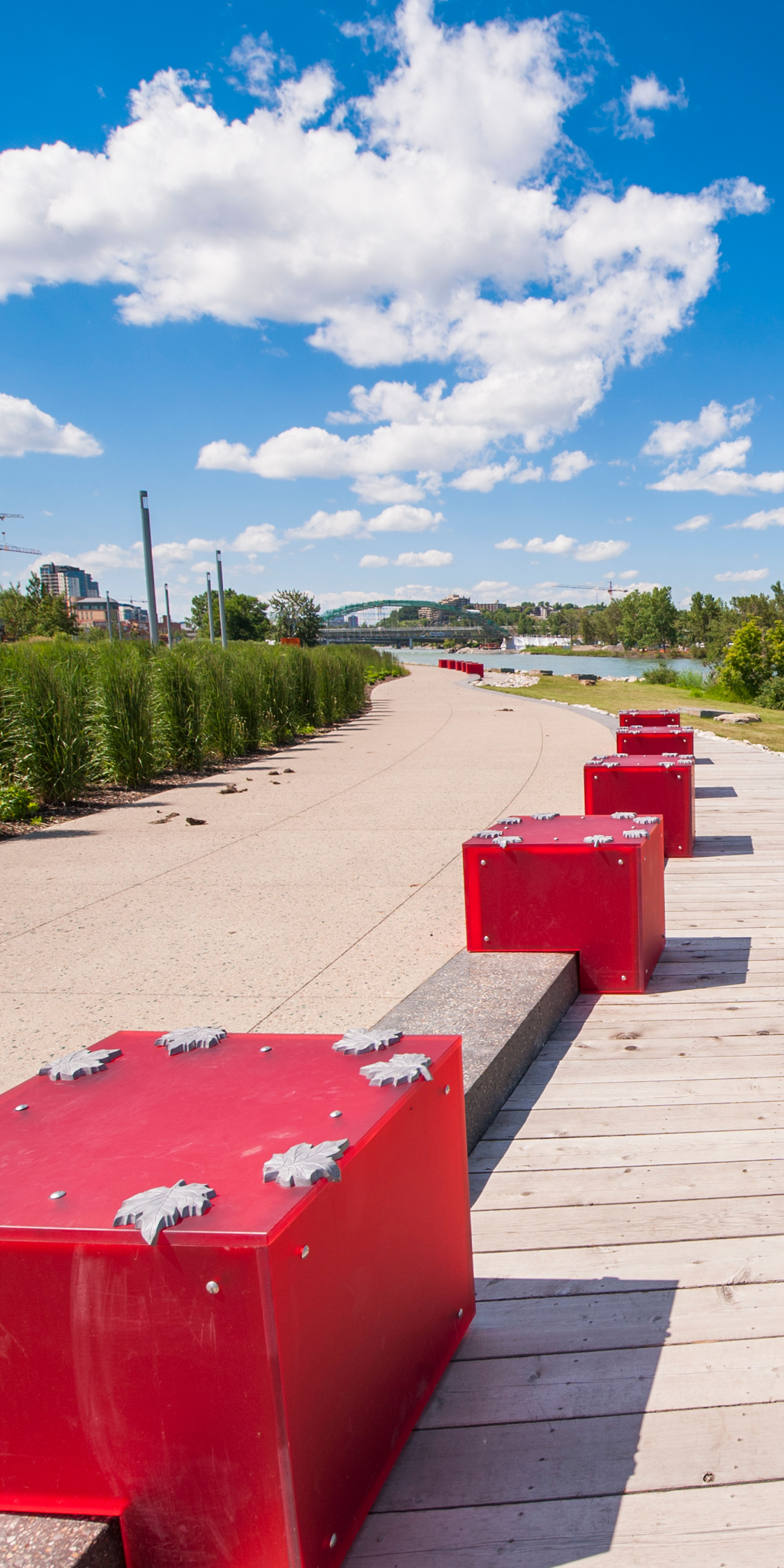 A photograph of RiverWalk with the lightboxes alongside the rivers edge