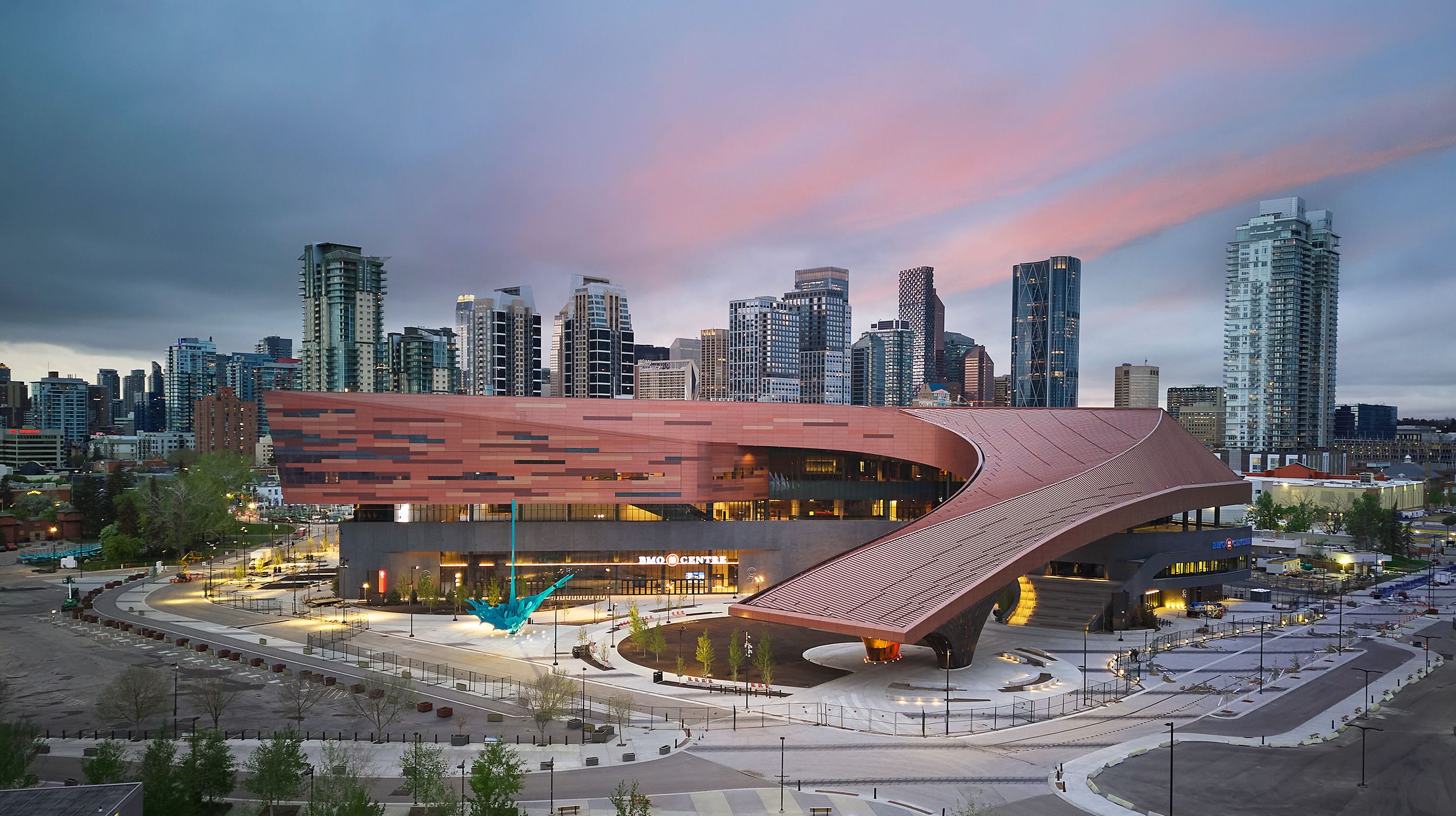 BMO Centre with Calgary downtown backdrop at dusk