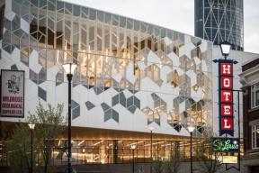 A photograph of Calgary Central Library in the early evening.