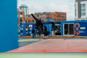 Photograph of a skateboarder doing a trick on a skate feature at Pixel Park.