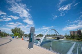 A photograph of George C. King bridge in the background and RiverWalk in the foreground