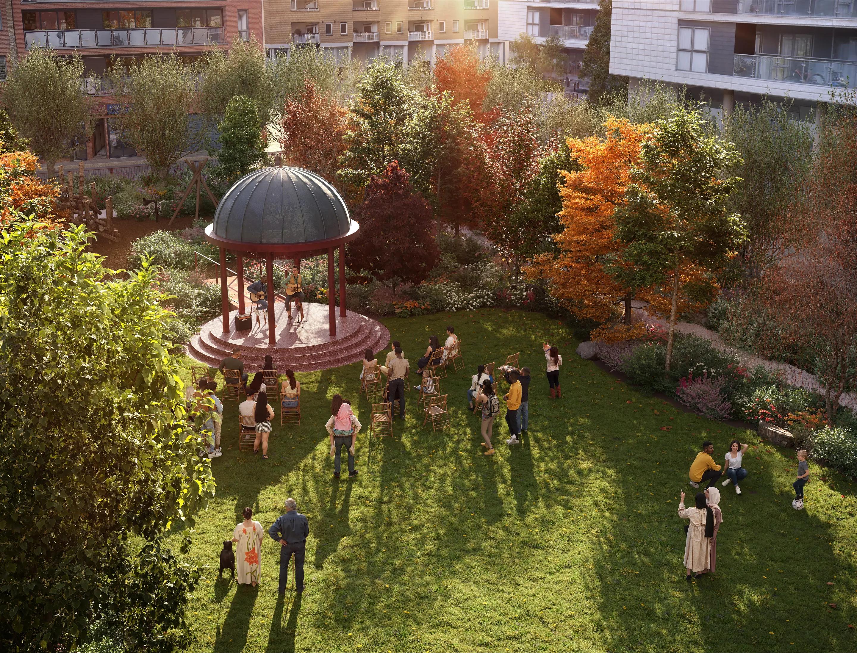 Garden square with domed bandstand, lawn and autumn trees