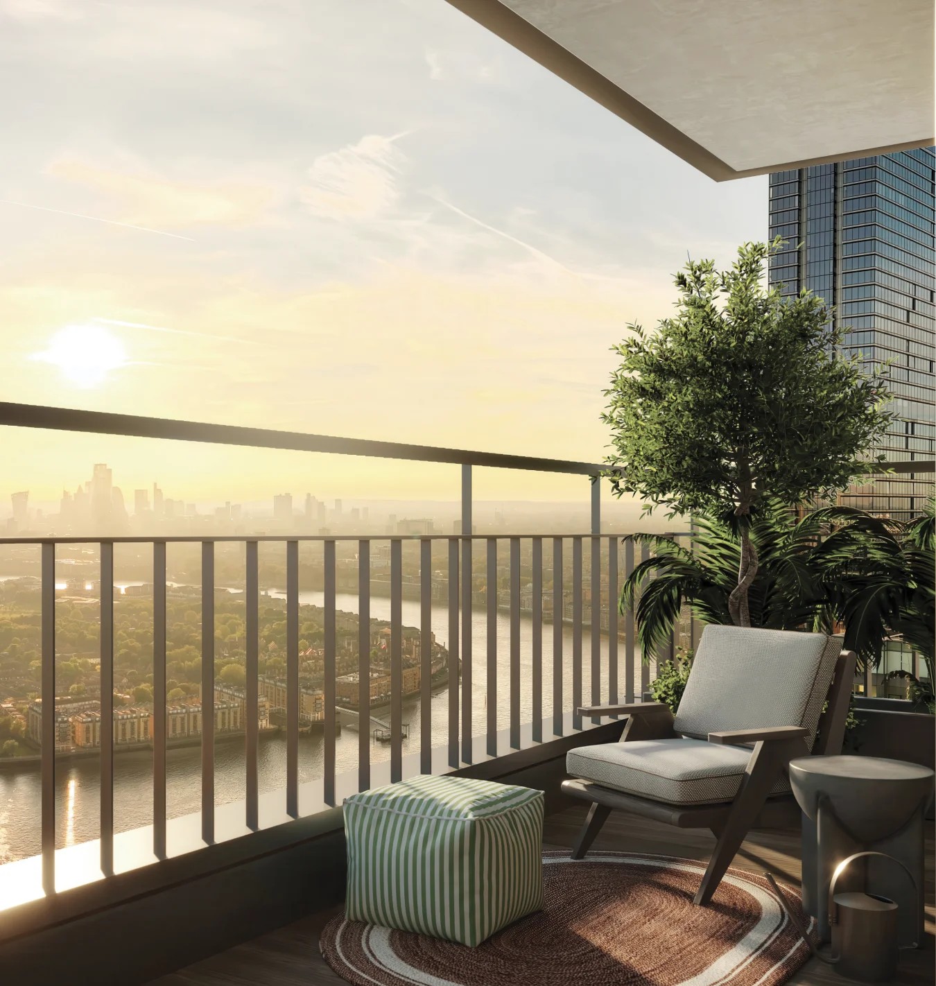 Balcony with lounge chairs overlooking the city at sunset