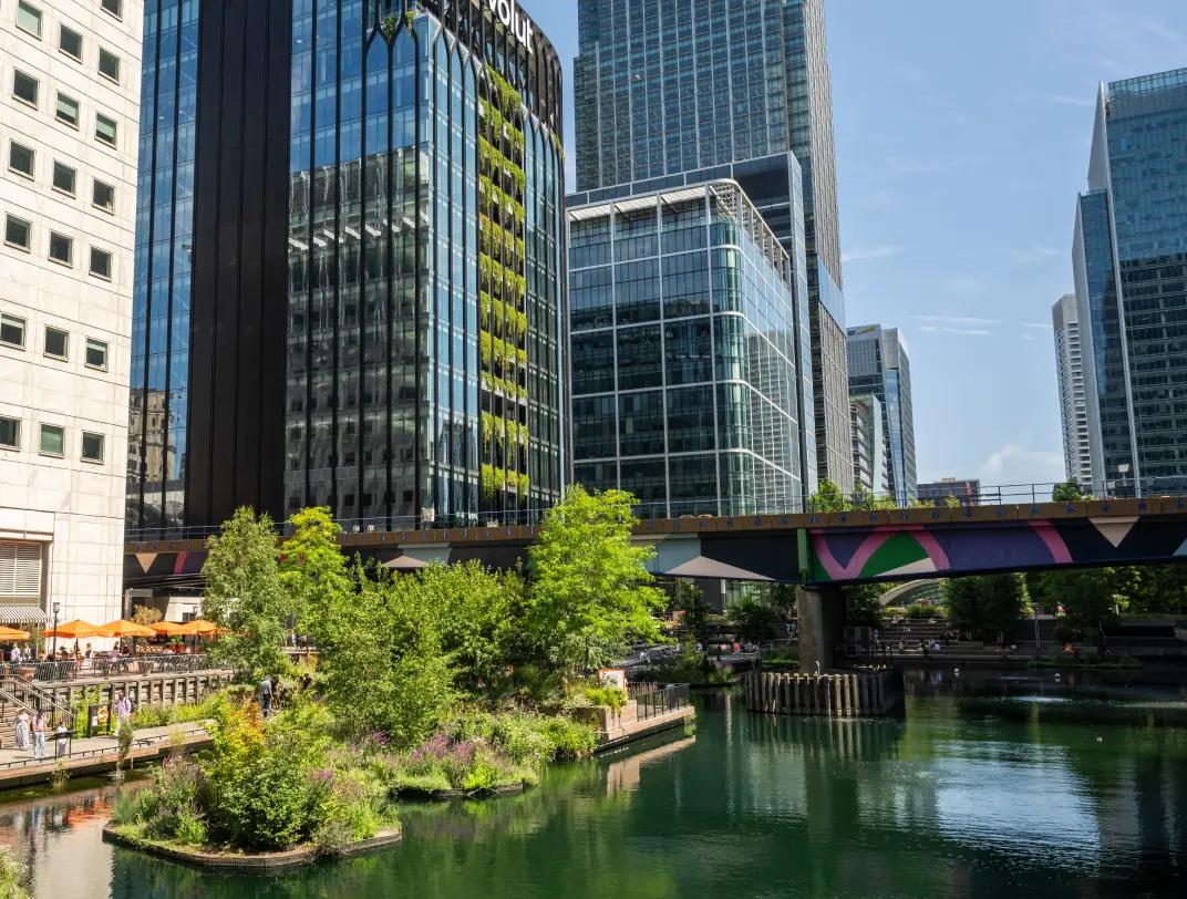 Canary Wharf station entrance among the trees