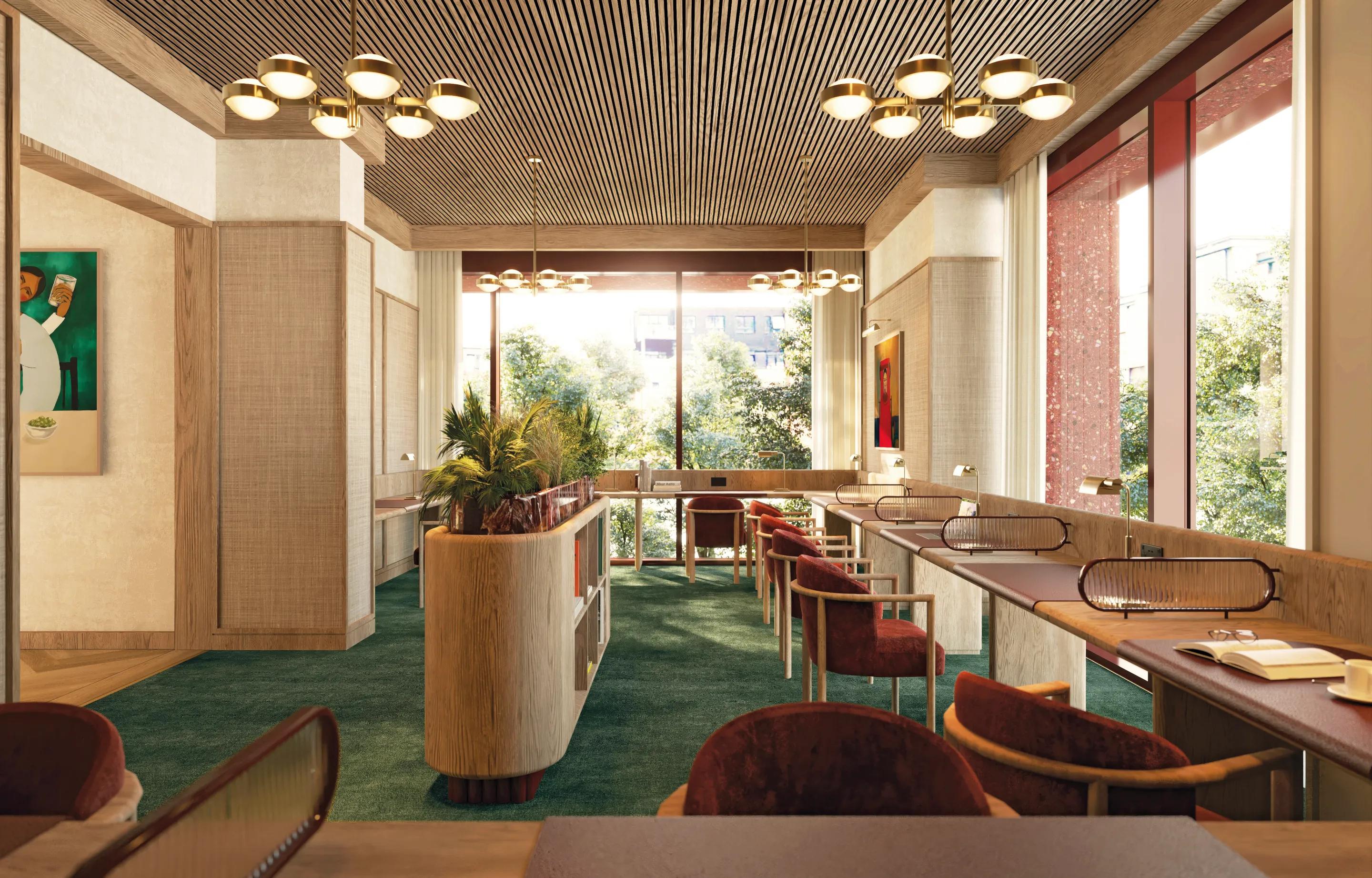 Quiet lounge with a long shared table and garden windows
