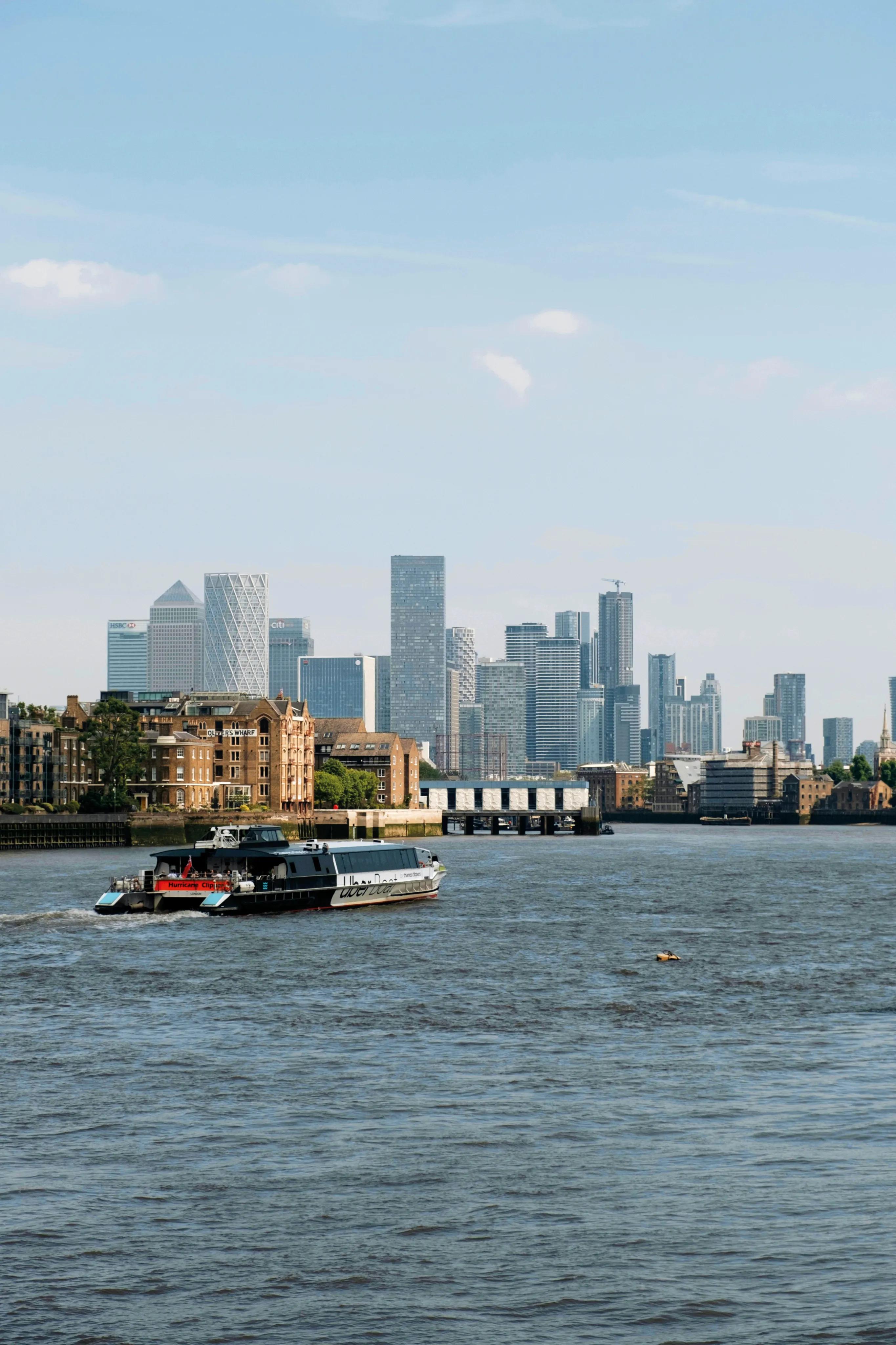 River boat passing the Canary Wharf skyline