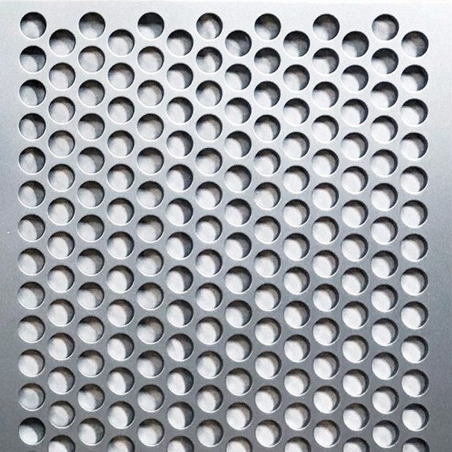 Aluminium panel punched with a dense grid of round holes