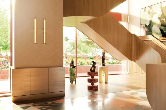 Reception lounge with pendant lamps, art and green sofas