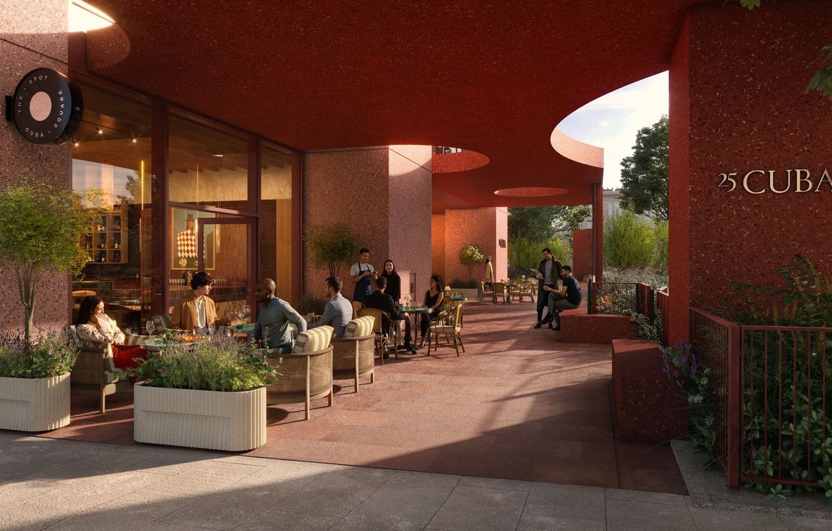 Residents at tables on the garden terrace at dusk