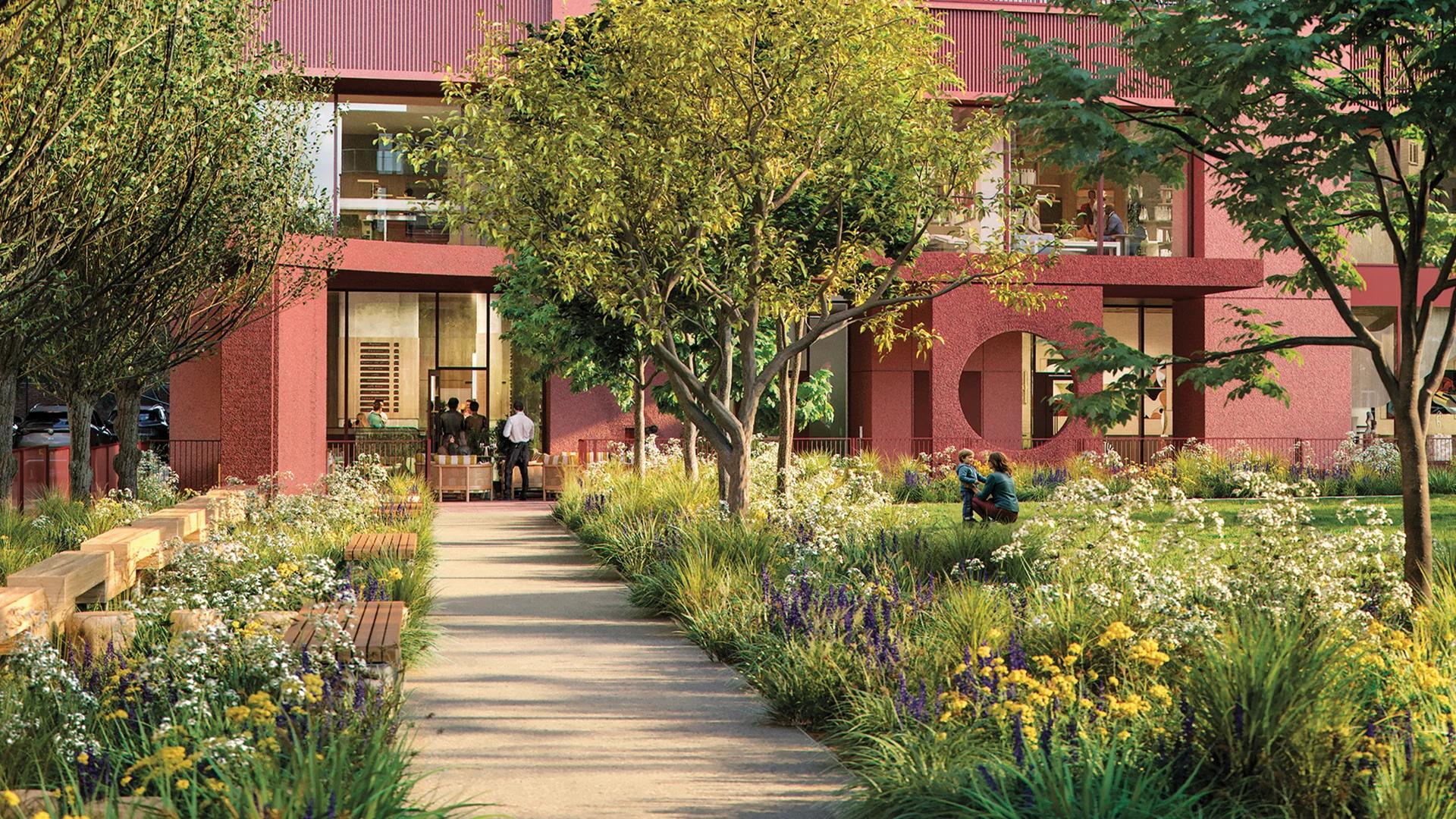 A planted path winding between the buildings