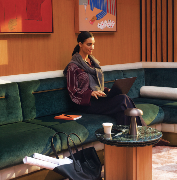 The reception lounge, artworks hung above a terrazzo floor