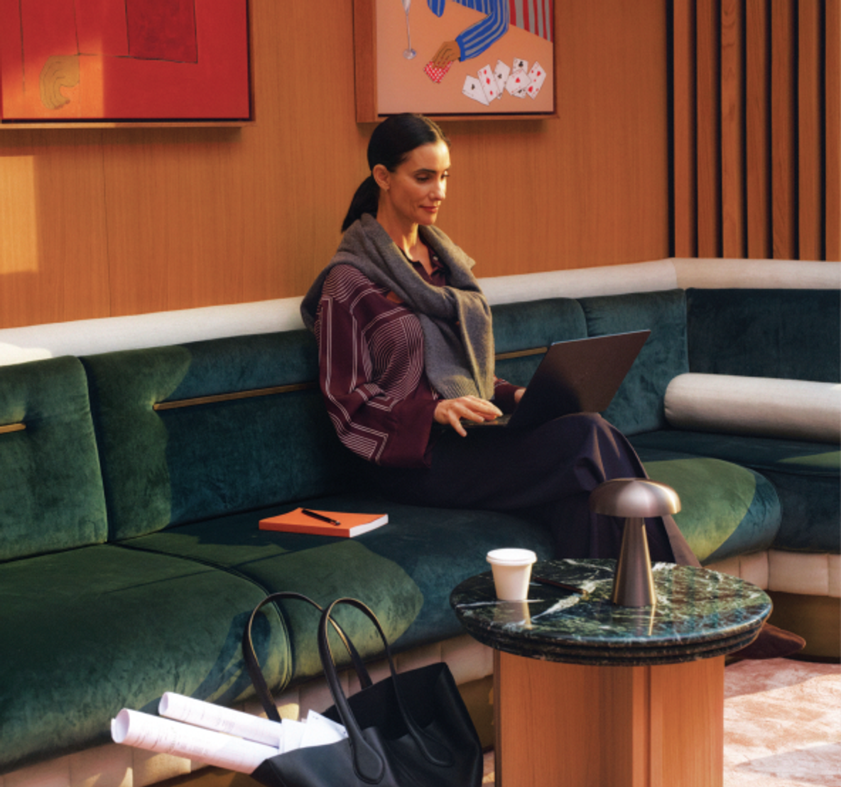 The reception lounge, artworks hung above a terrazzo floor