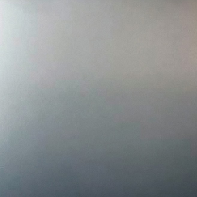 Smooth matt aluminium sheet under a soft gradient of light