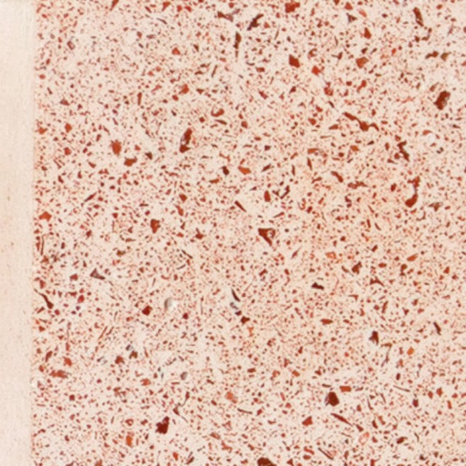Pale blush concrete with fine red and white speckle