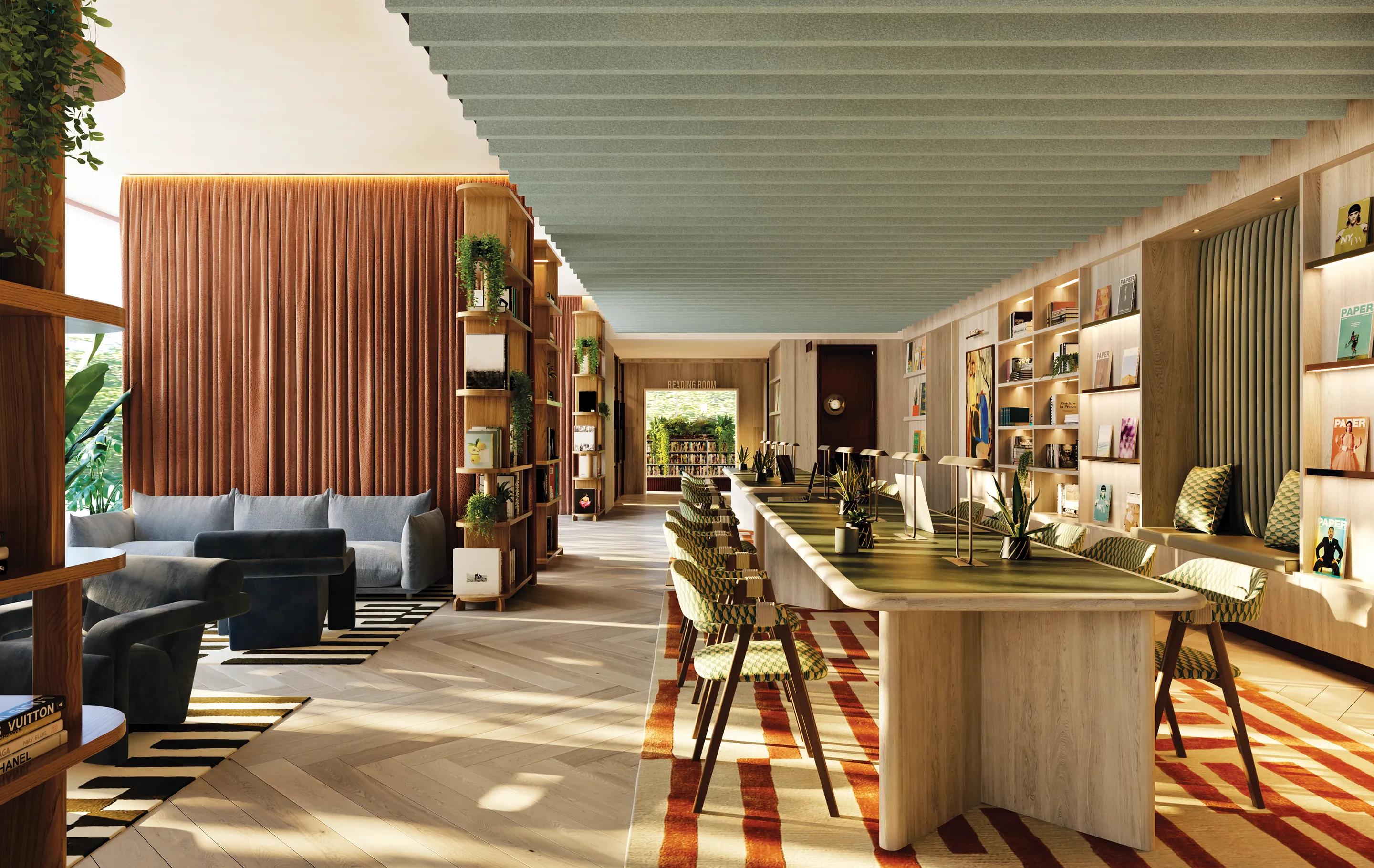 Co-working floor with long timber desks and bookshelves