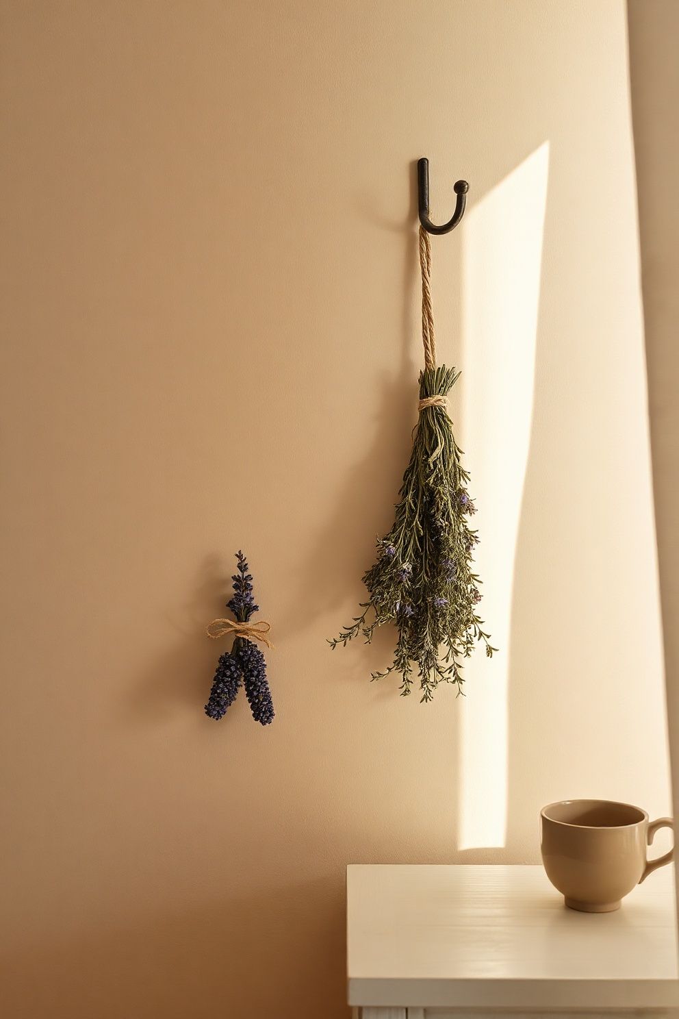 Dried Herb Bundles Tied With Linen Twine Hanging From an Iron Hook – coastal — bedroom coastal — bedroom decor · Coastal Cottage Bedroom: 15 Charming Designs Full of Character and Relaxed Beauty