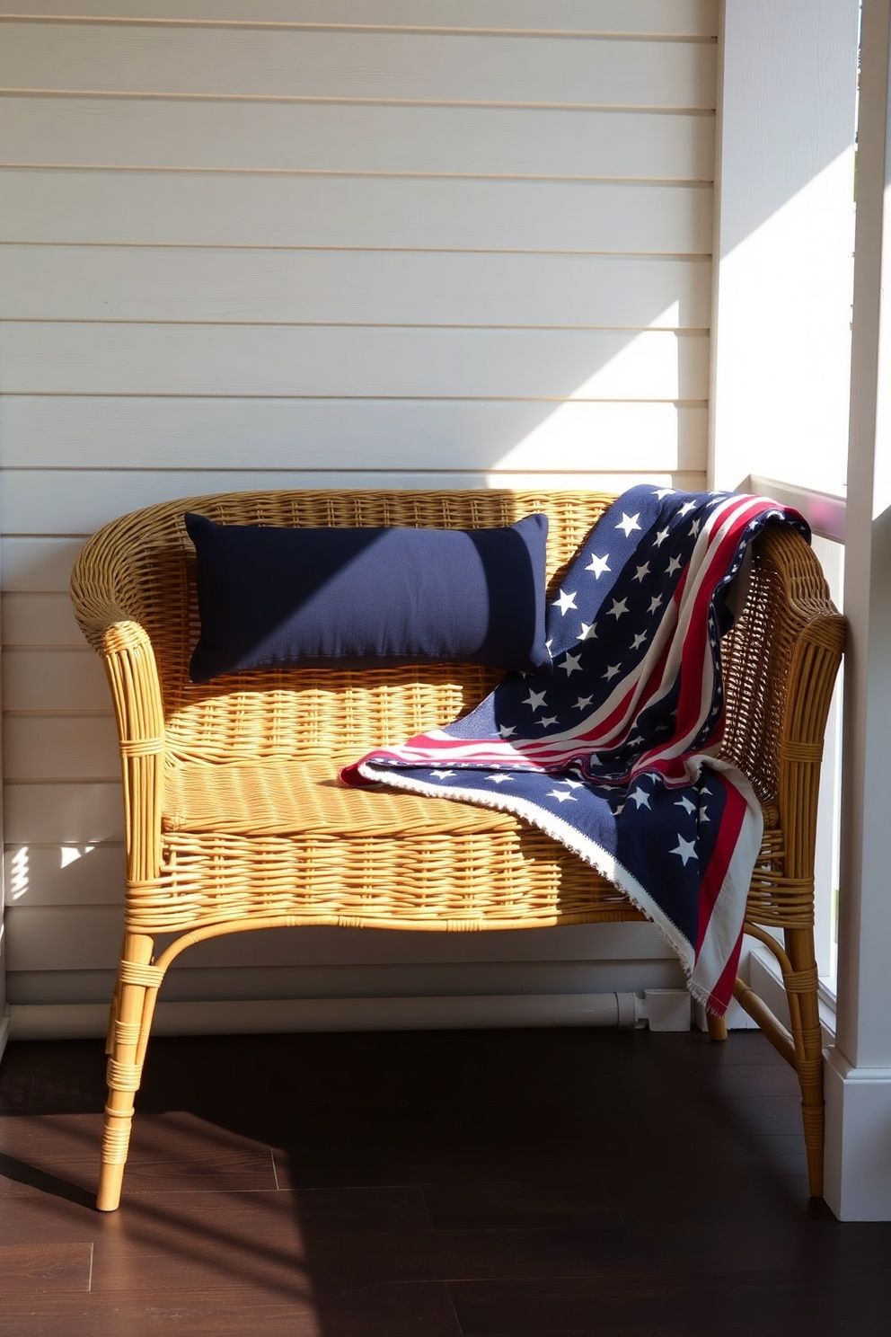 Wicker Porch Bench With Navy Bolster Pillow and Flag-Print Blanket – seasonal — spring + other seasonal — spring + other decor · 4th of July Porch Decor: 14 Festive Front Door Designs for Independence Day