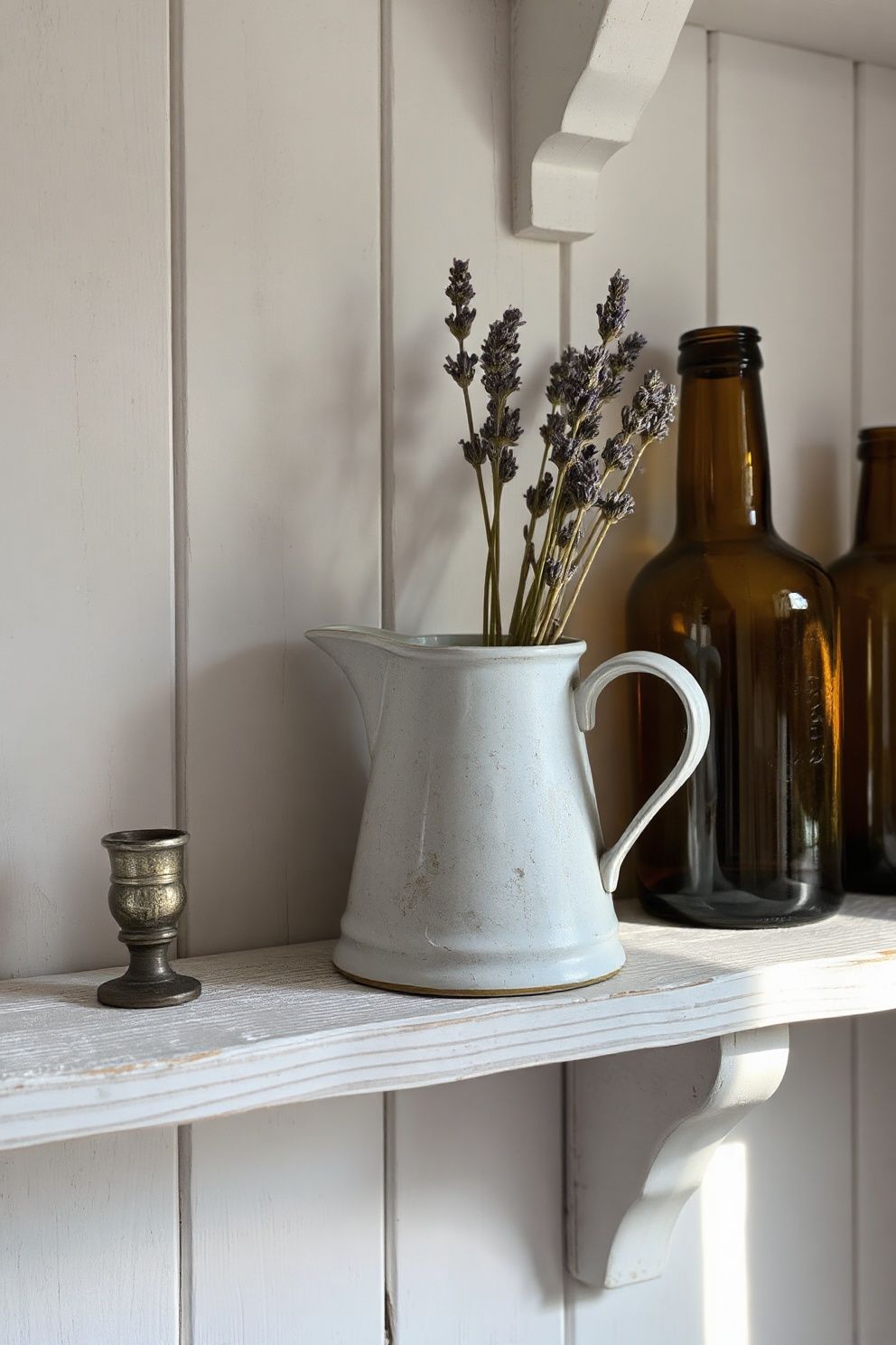 Chipped Enamel Jug Holding Dried Sea Lavender on a Peeling White Shelf – coastal — bedroom coastal — bedroom decor · Coastal Vintage Bedroom: 14 Timeworn Designs Full of Faded Beauty and Soul