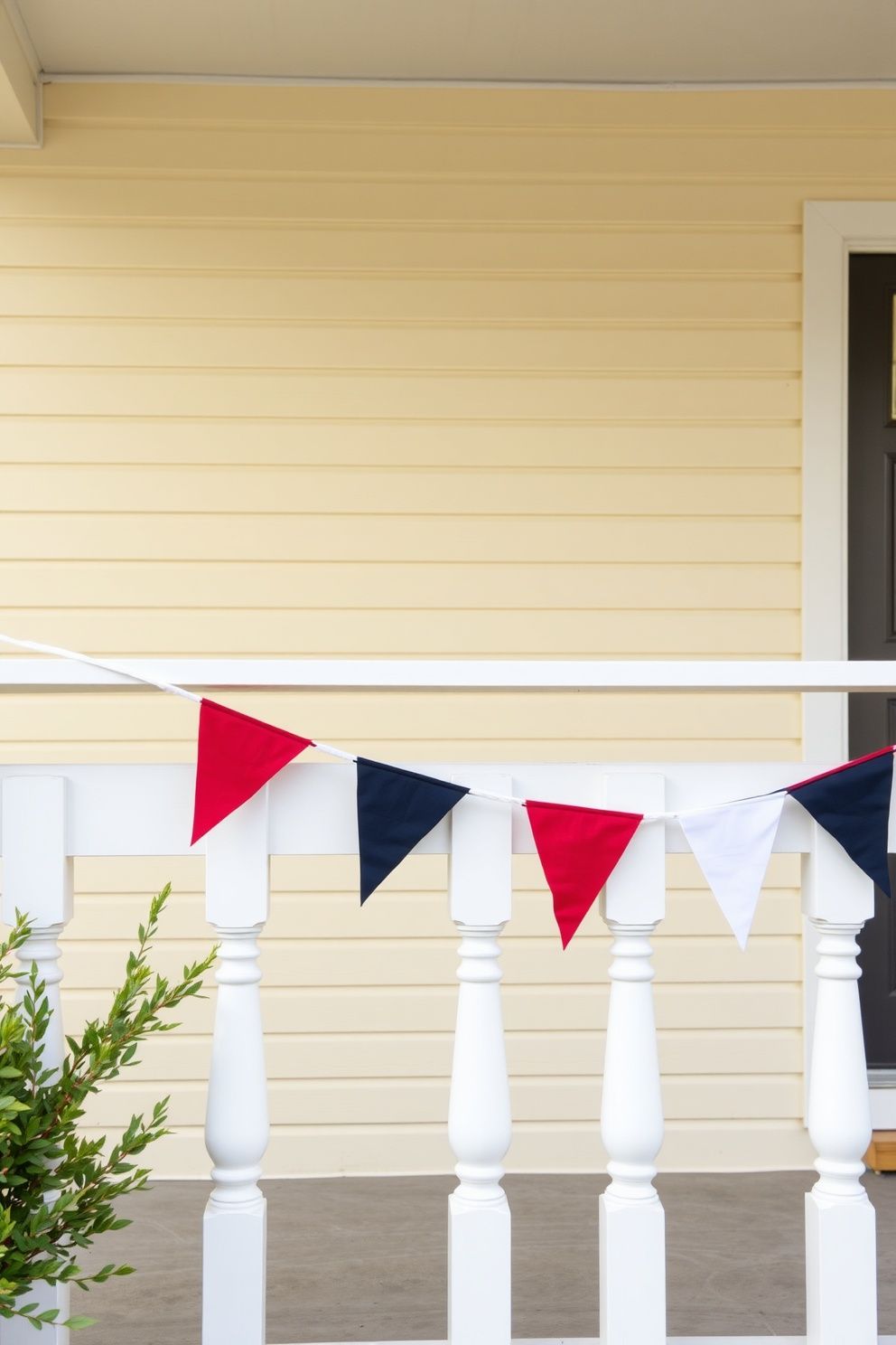Stars-and-Stripes Pennant Banner Strung Across Porch Railing – seasonal — spring + other seasonal — spring + other decor · 4th of July Porch Decor: 14 Festive Front Door Designs for Independence Day