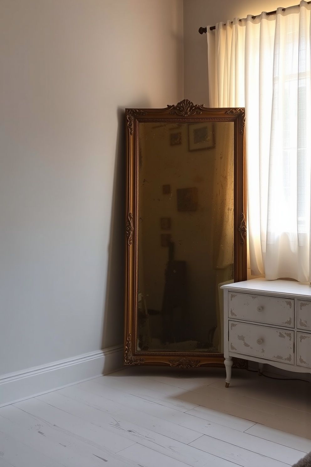 Large Foxed Glass Mirror in a Tarnished Gold Frame Propped Against the Wall – coastal — bedroom coastal — bedroom decor · Coastal Vintage Bedroom: 14 Timeworn Designs Full of Faded Beauty and Soul