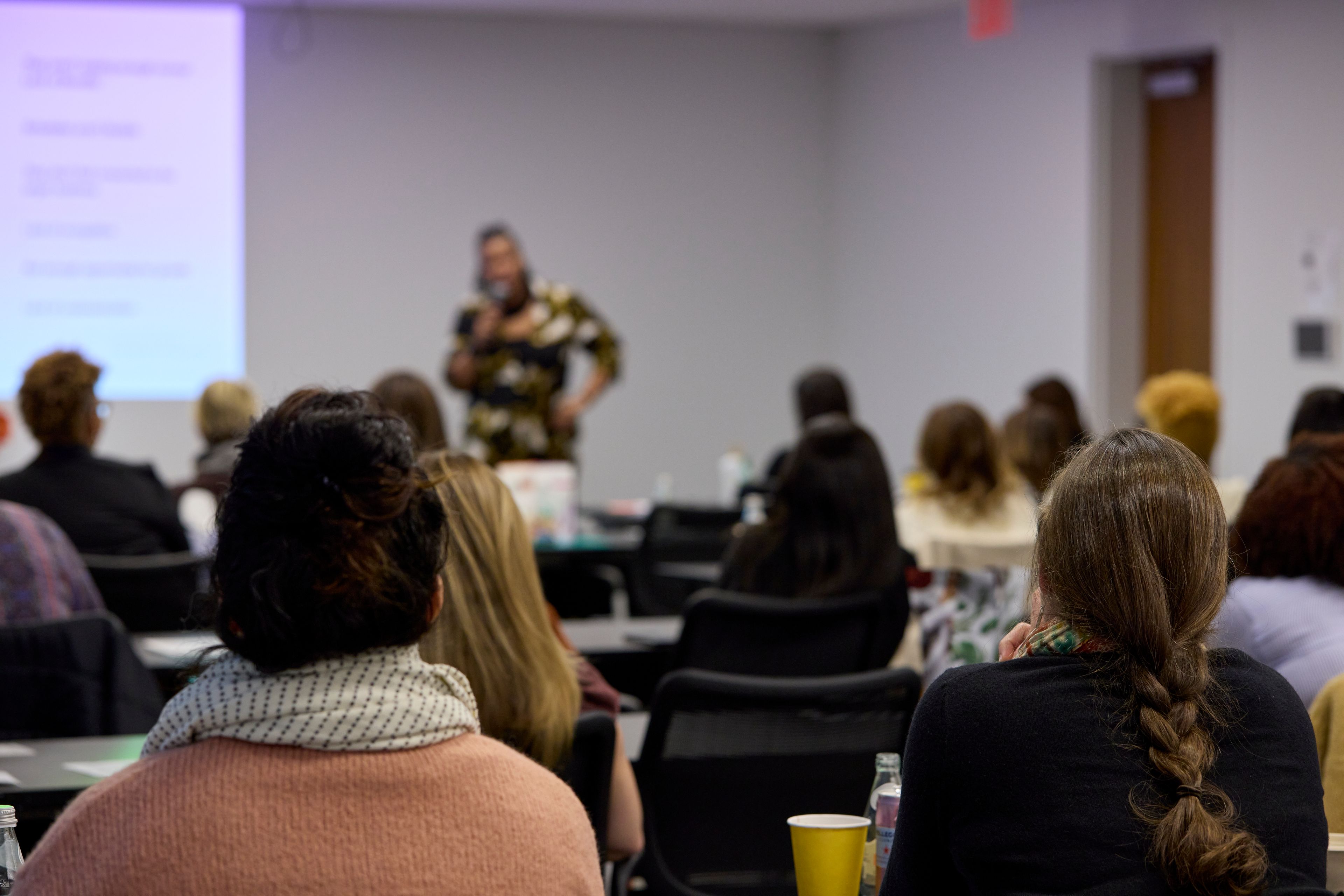 Group of women watching a speaker