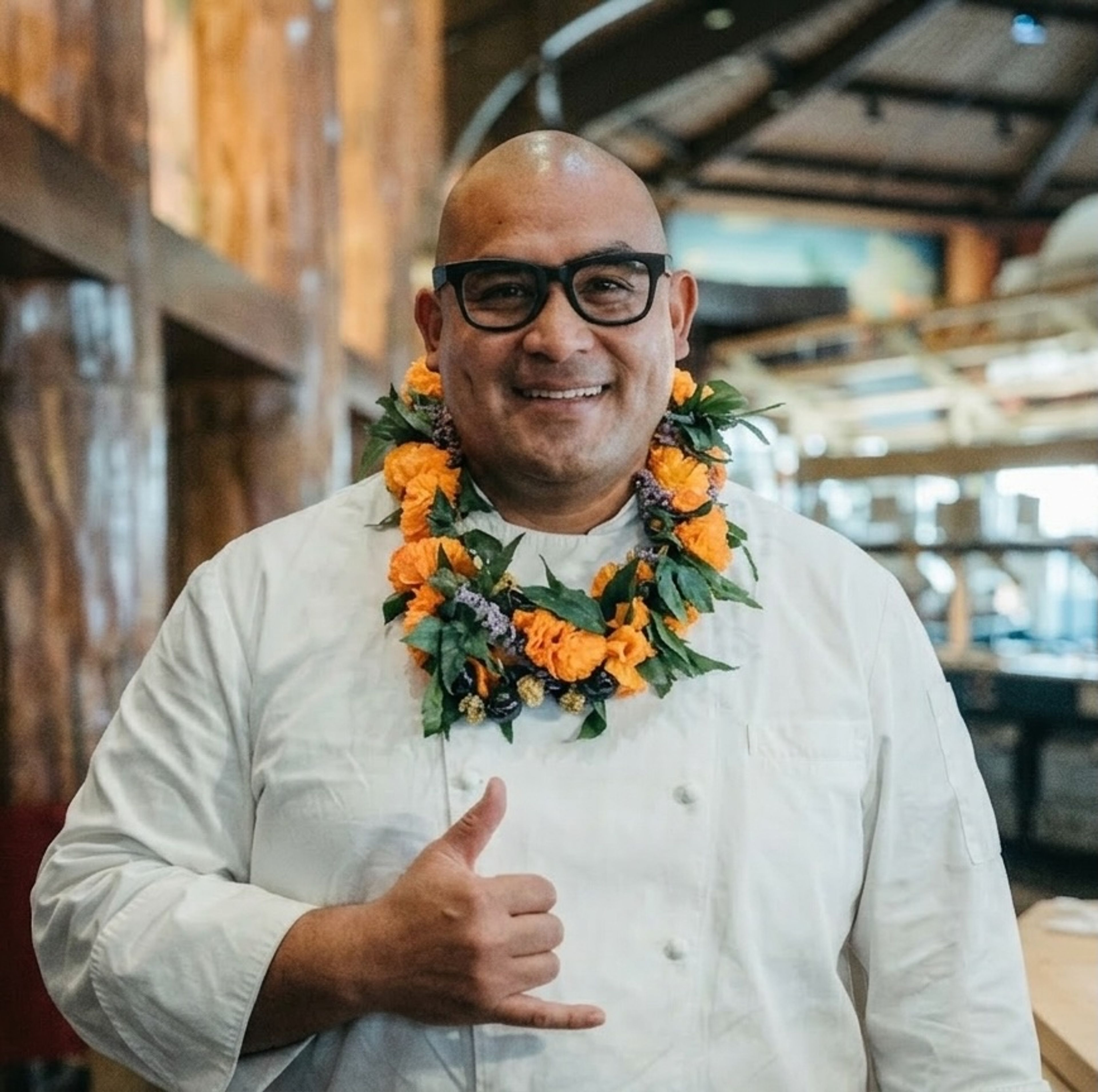 Felix Tai headshot with a lei