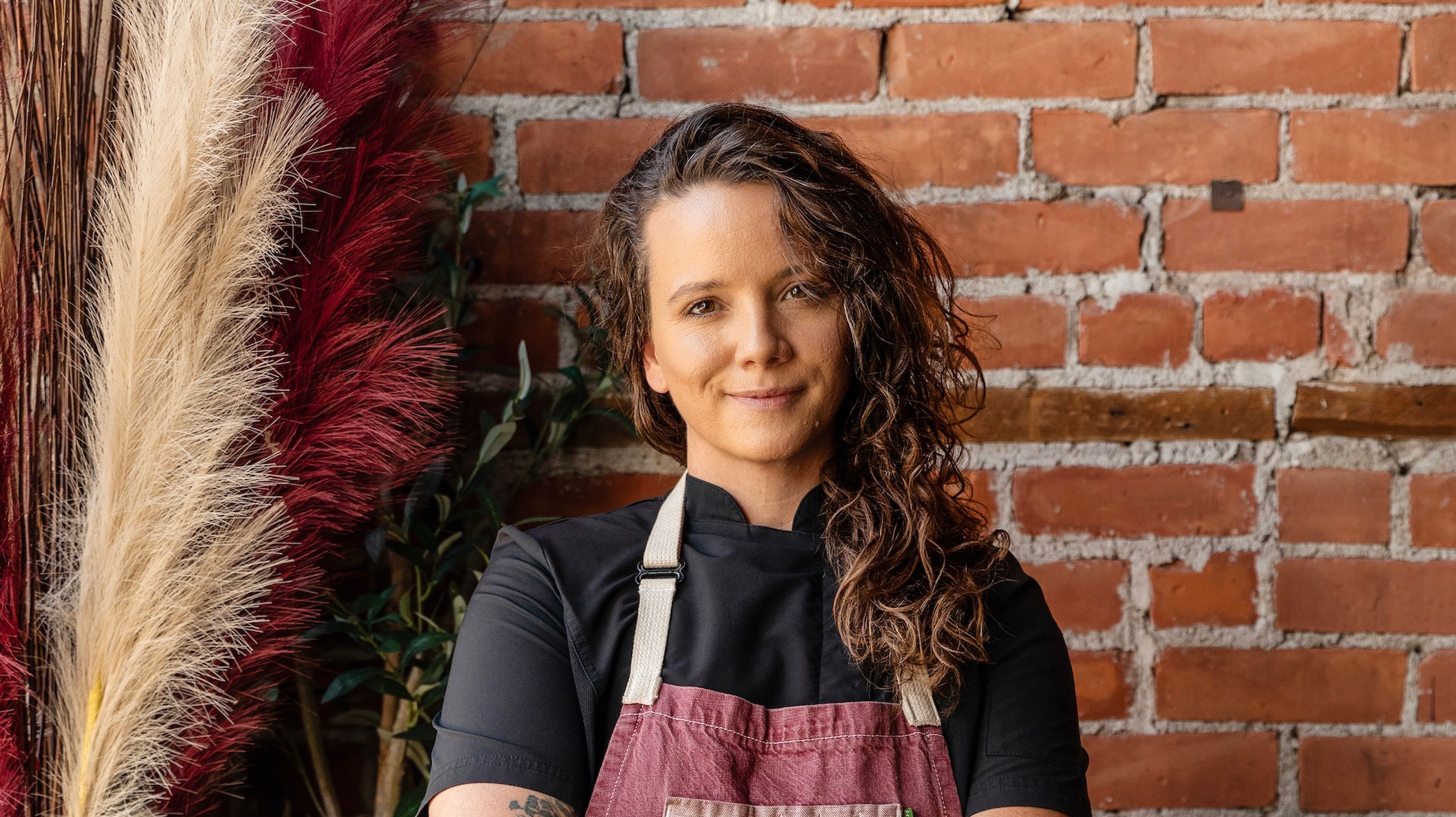 Sarah Welch professional shot in front of a brick wall