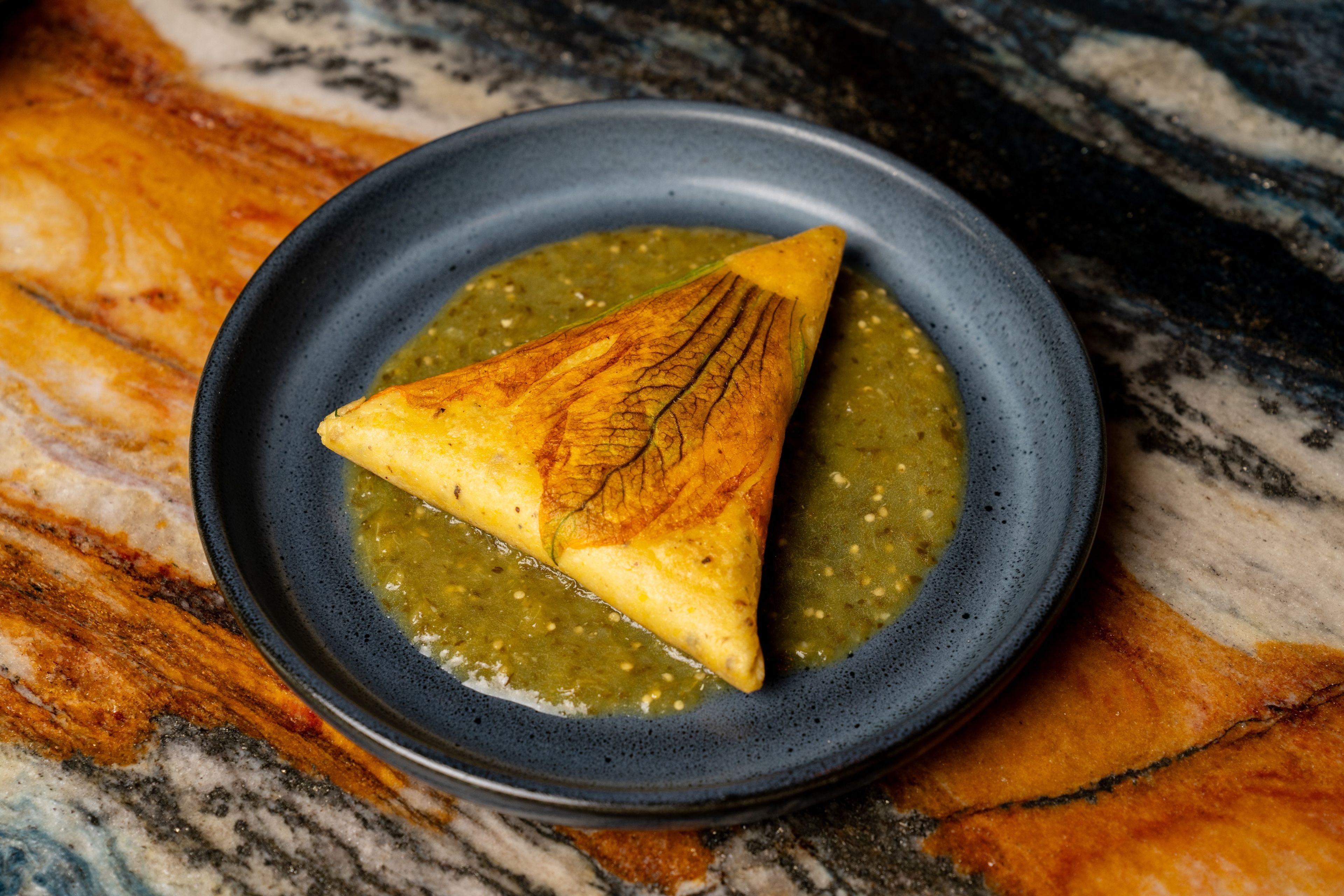 The squash blossom tetela at Maximo. (Photo: Carla Gomez)