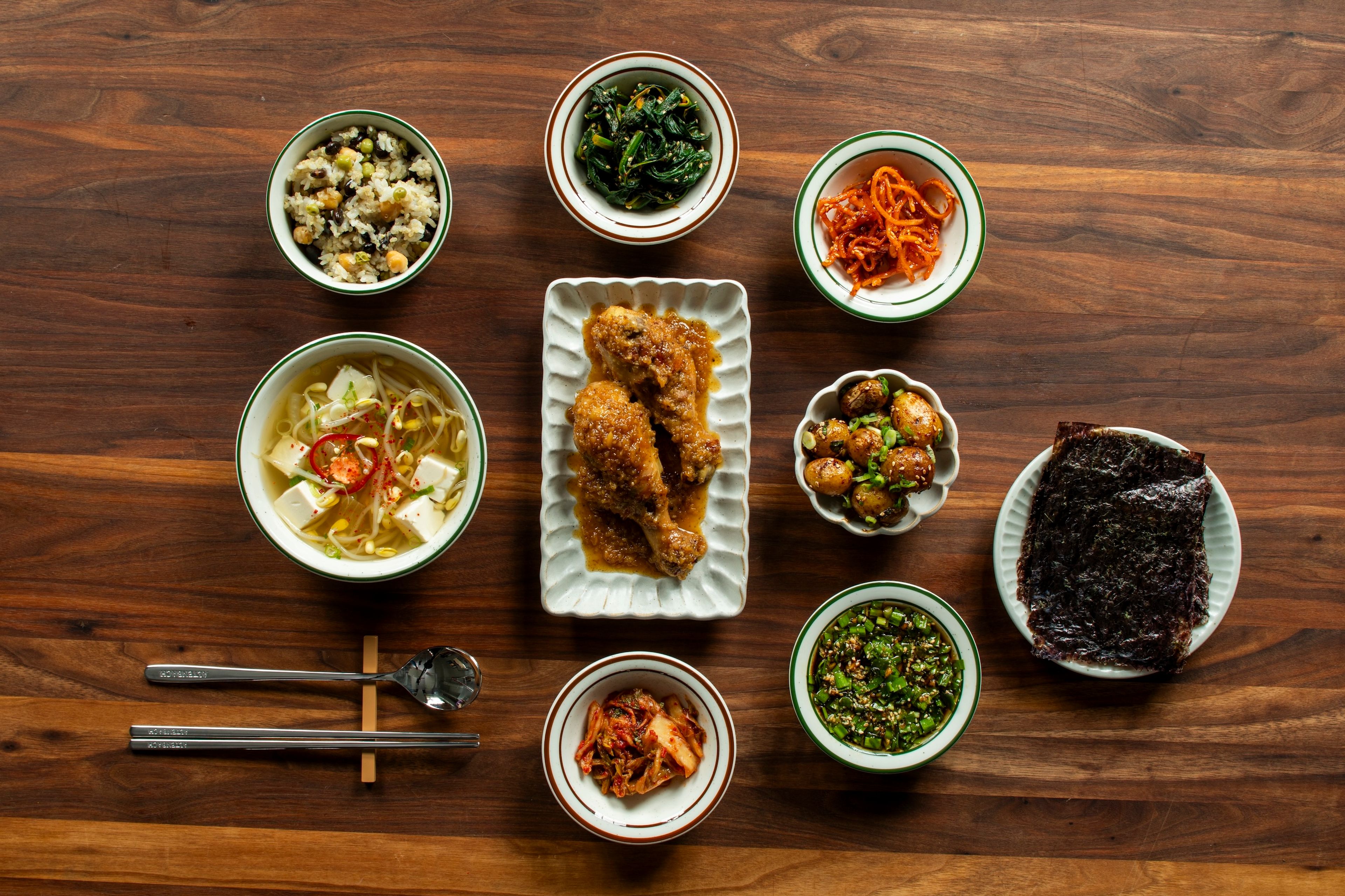 A traditional Korean meal includes a main protein, multiple banchan, soup, and rice. (Photo: Kritsada Panichgul)