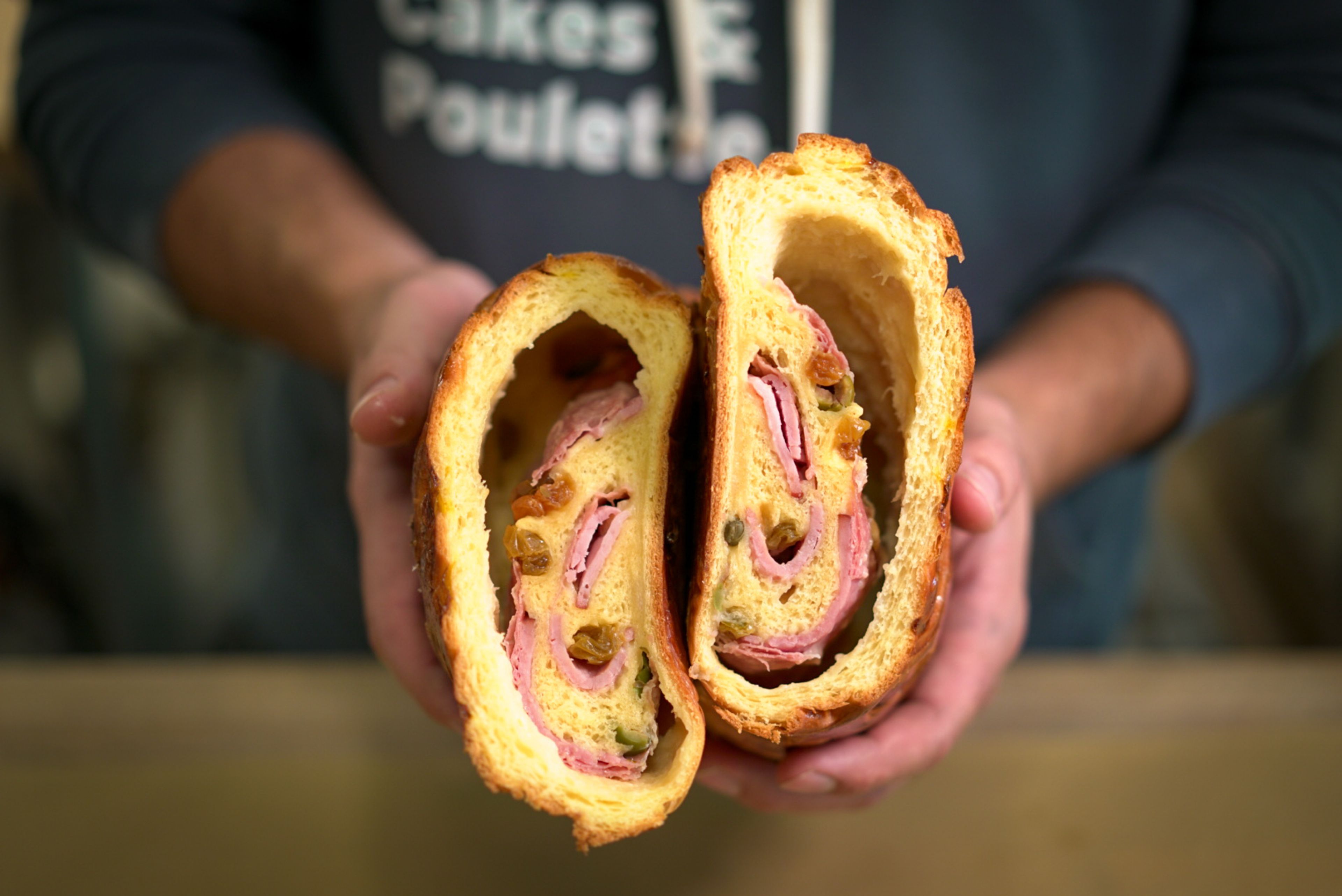 Poulette Bakeshop's pan de jamón features ham, prosciutto, capers, green olives, and raisins.