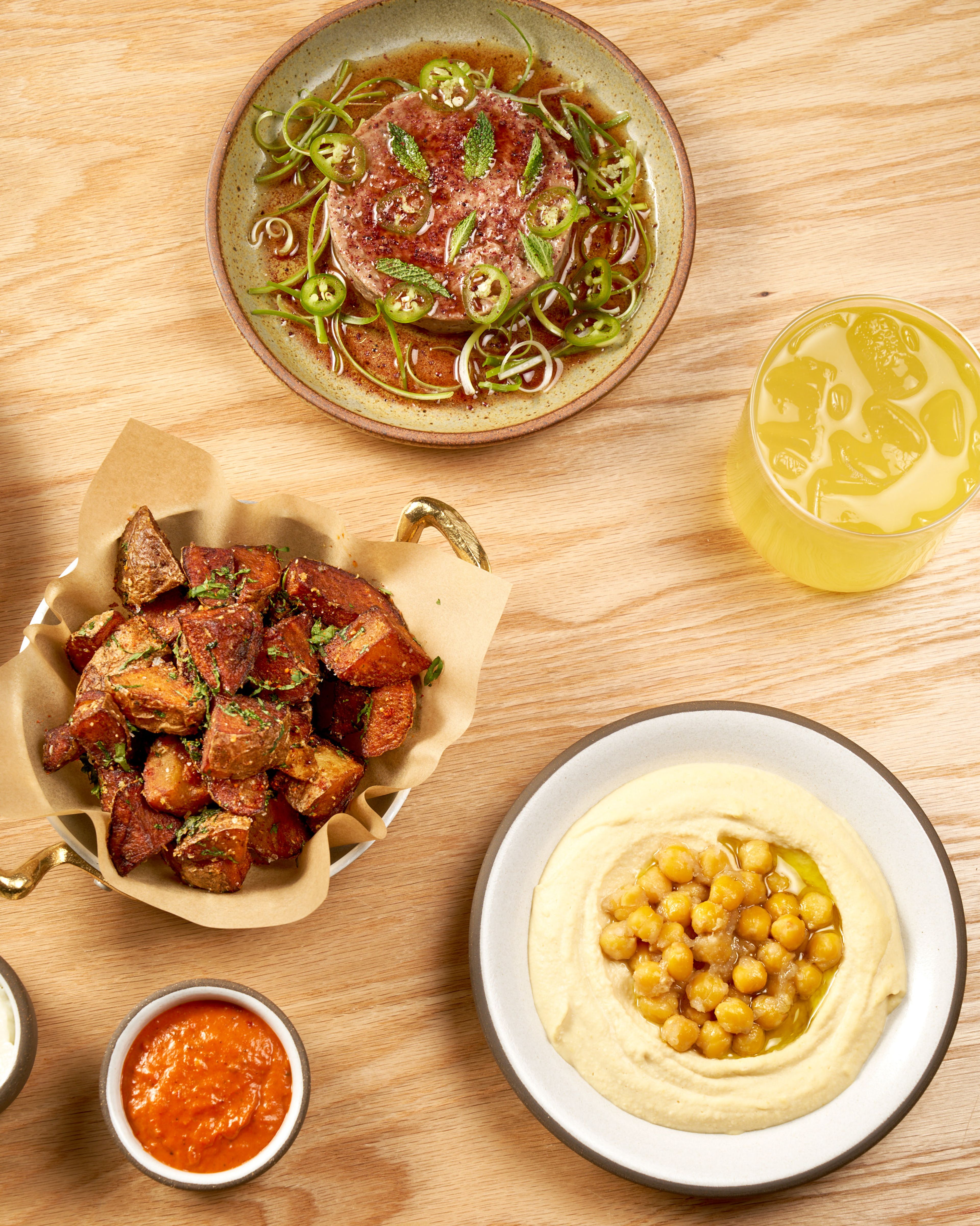 Various dishes and drinks on a wooden table