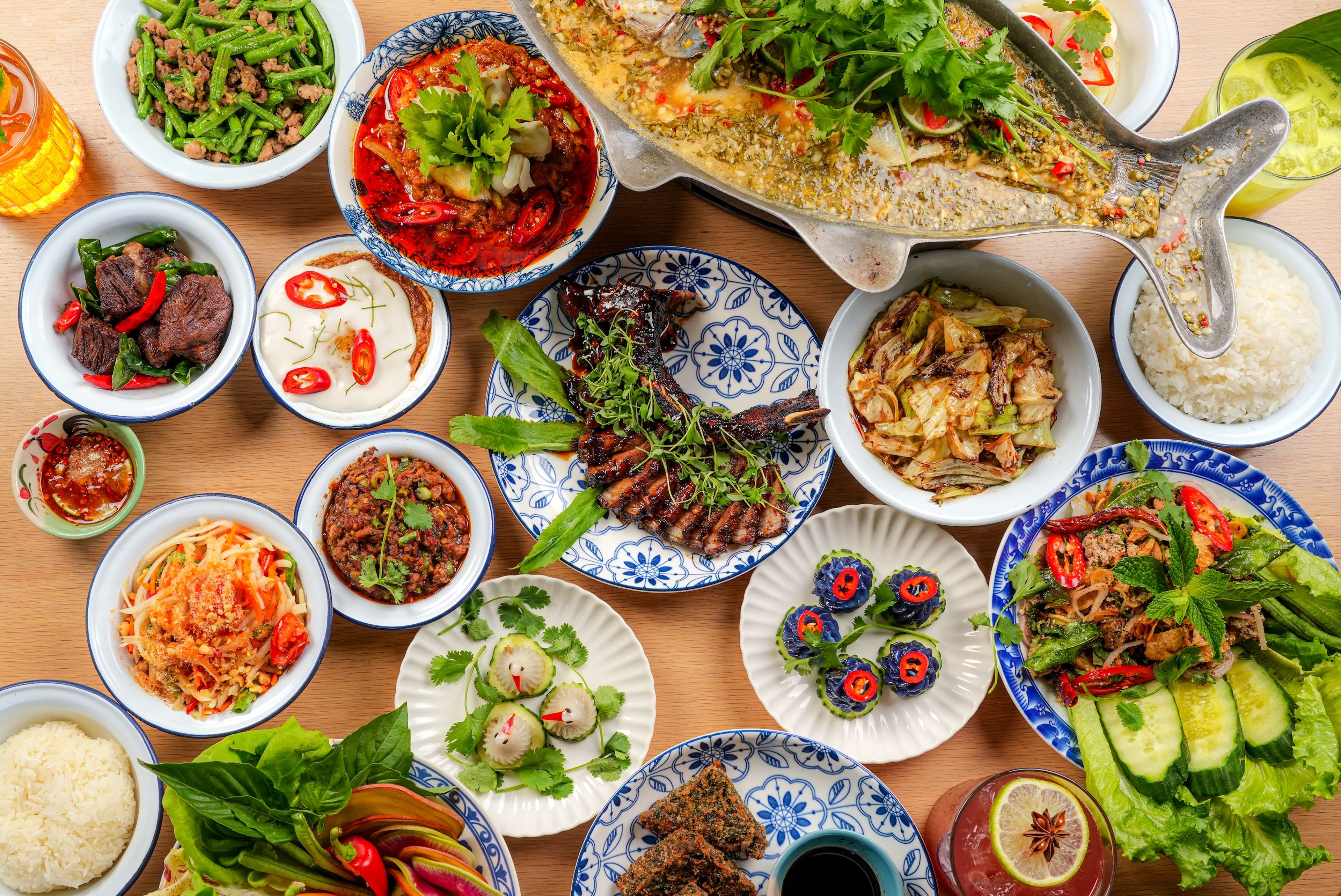 A spread of dishes at Kalaya, including their famous dumplings and whole branzino. (Photo: Mike Prince)