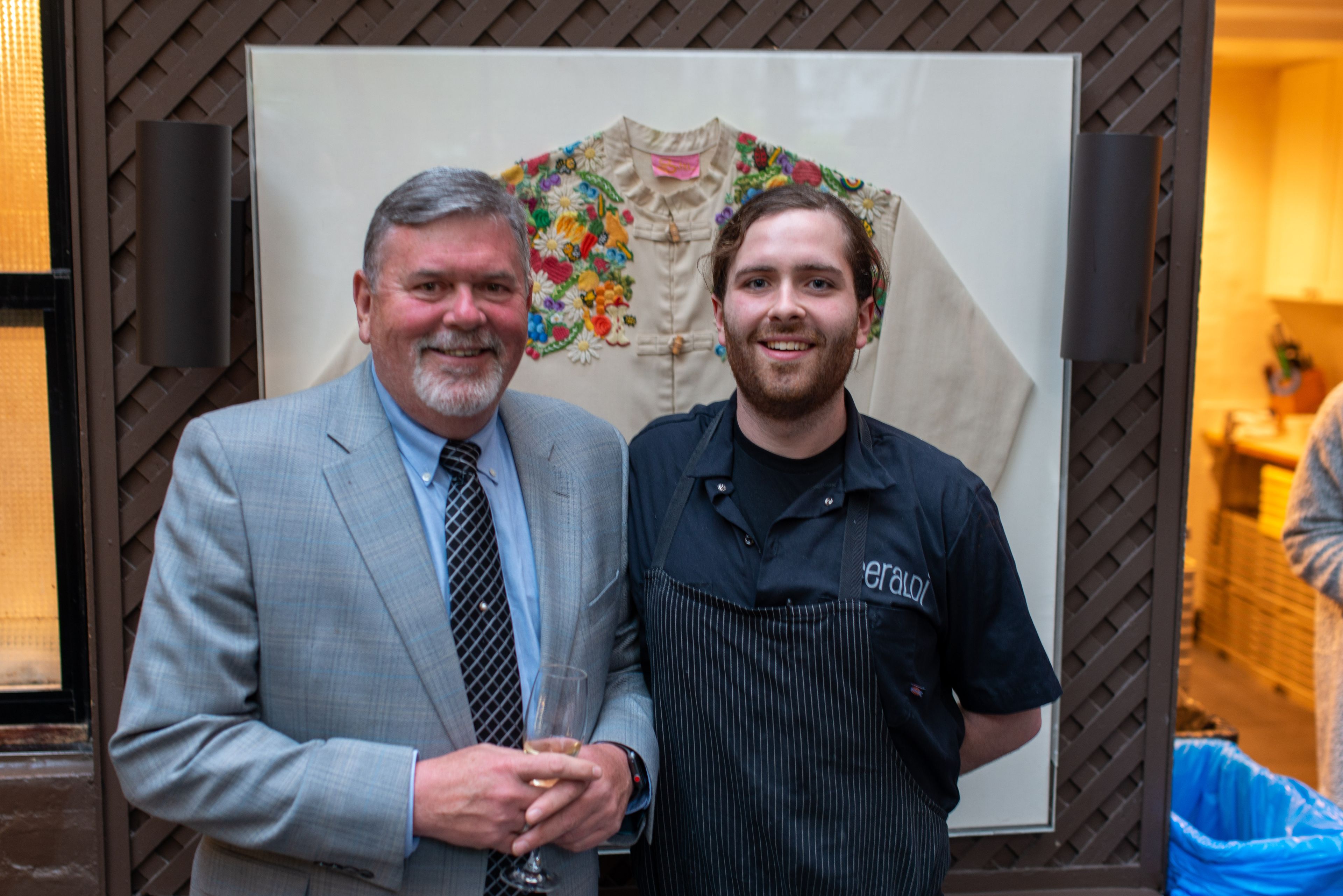 guest and chef posing at event